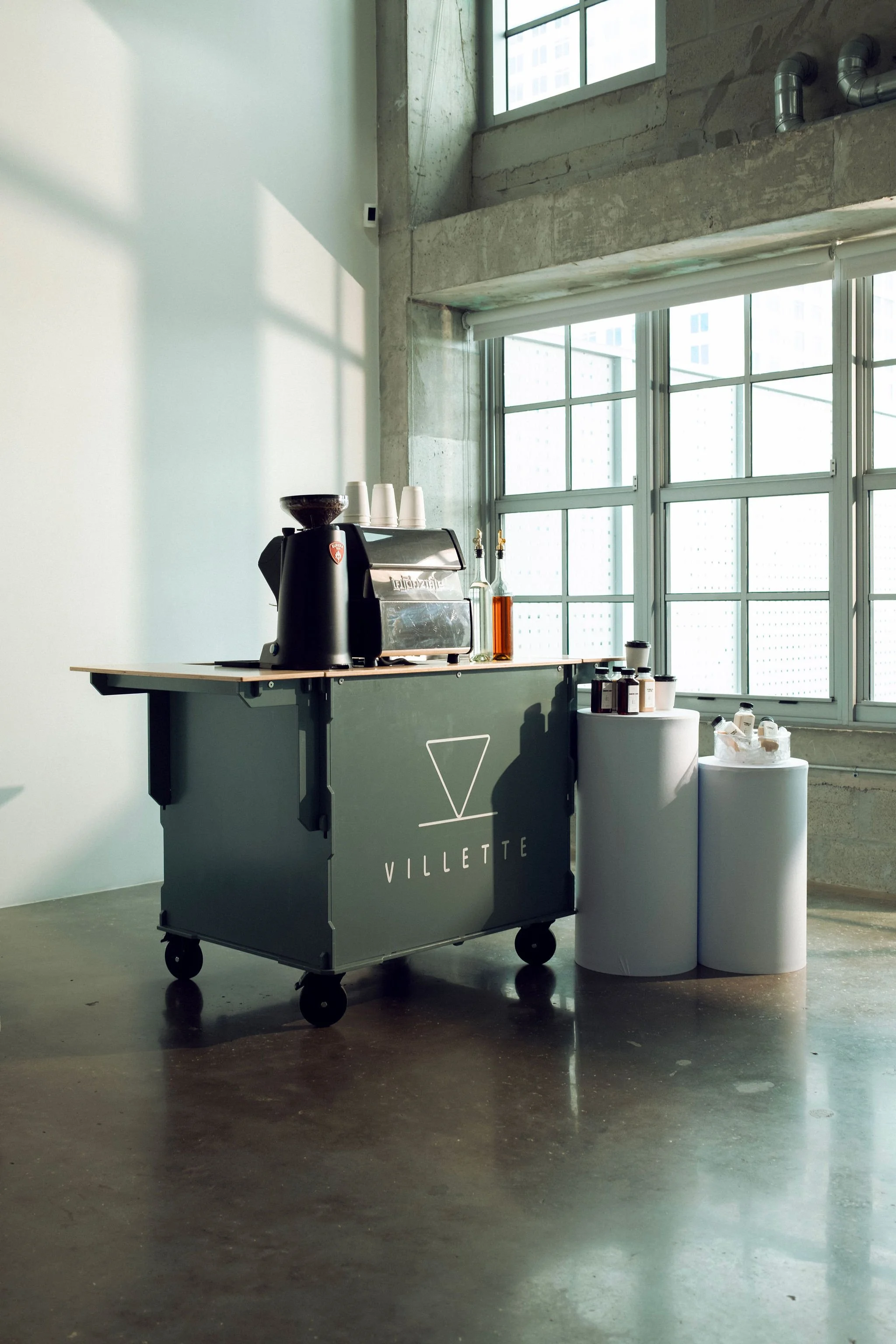 Professional barista preparing drinks at mobile coffee cart in Miami