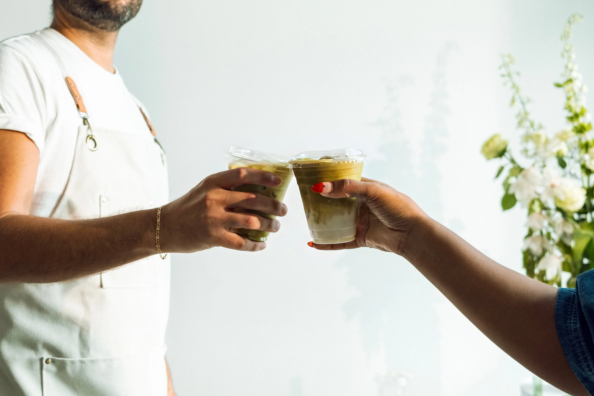 Guests toasting lattes at a luxury Miami coffee cart event