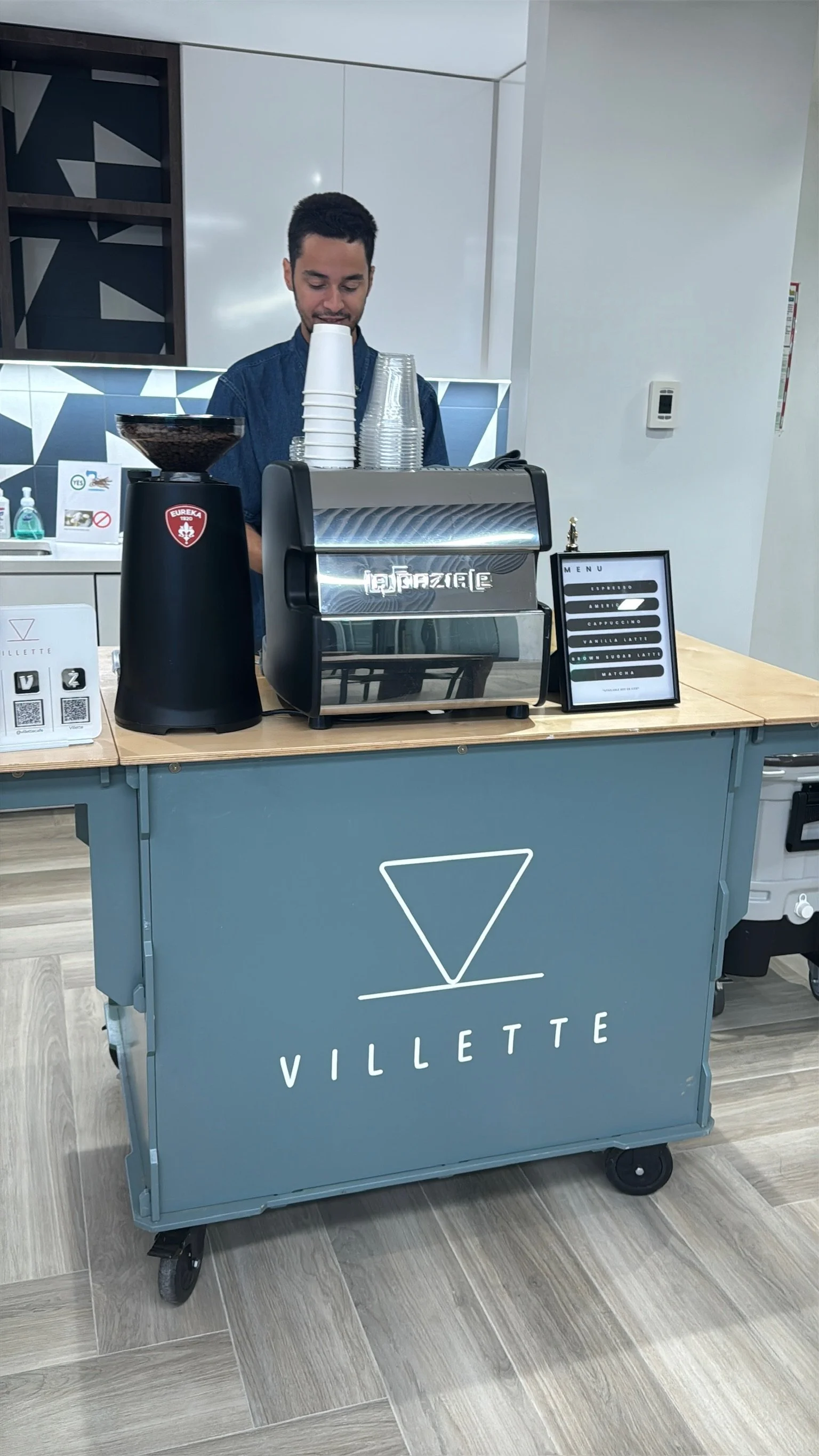 Barista operating espresso machine at Villette Coffee Cart mobile coffee bar in Miami