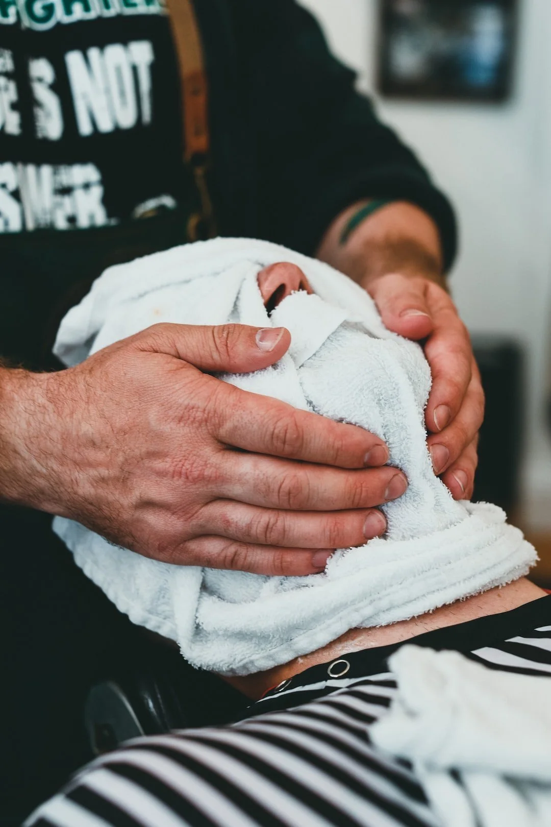 Hot Towel over Face at the Rooted Barbershop