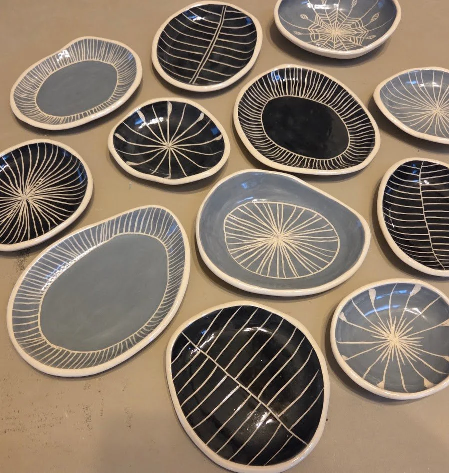 Hand-built ceramic plates shaped from river rocks