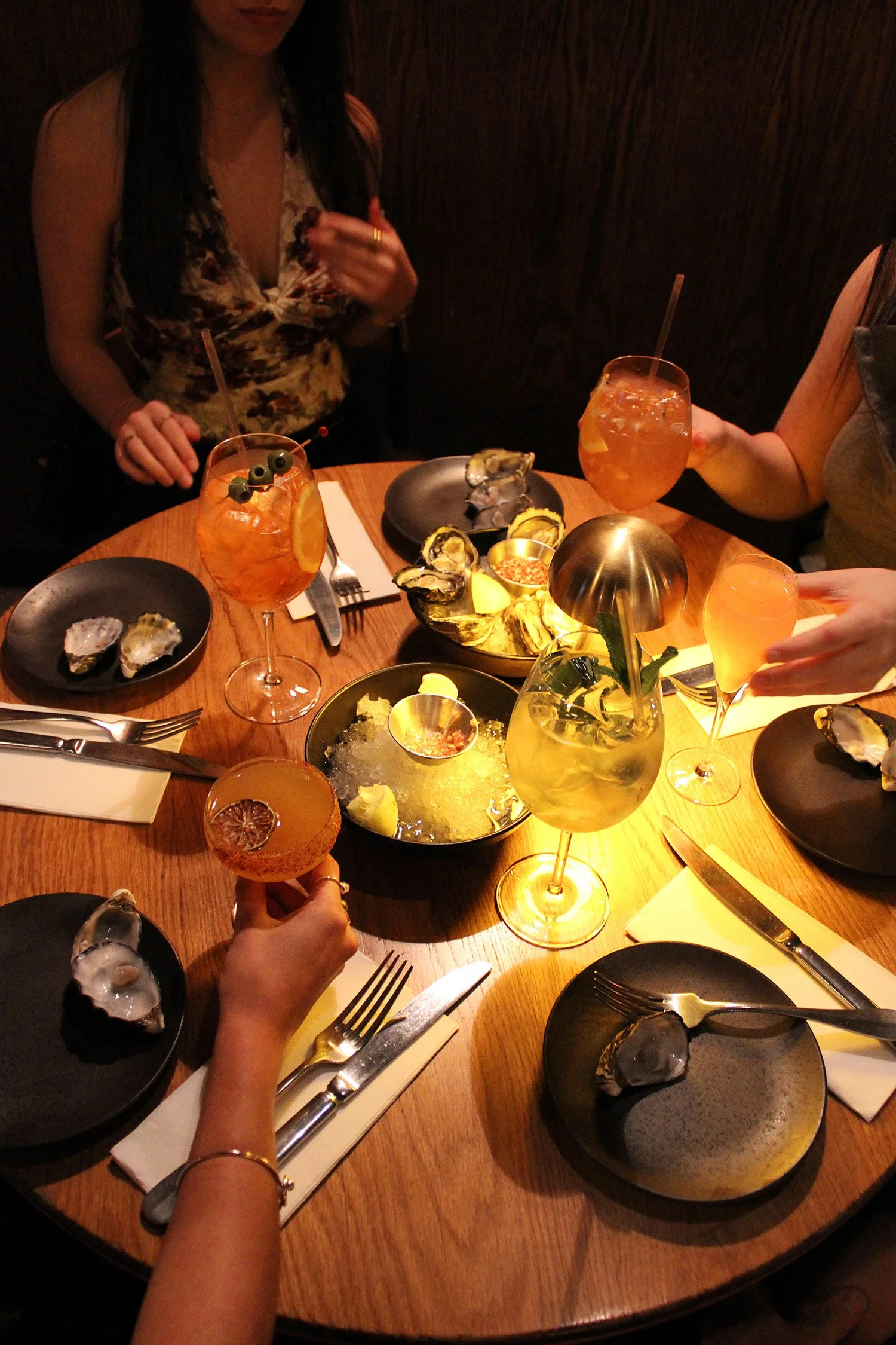 drinks, table , oysters, girls.jpg