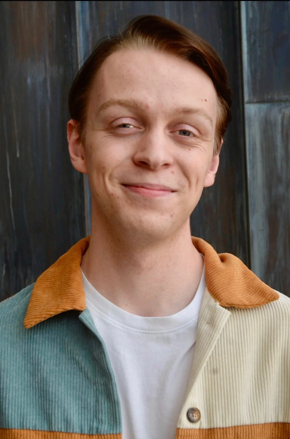 Headshot Brown Grin.JPEG
