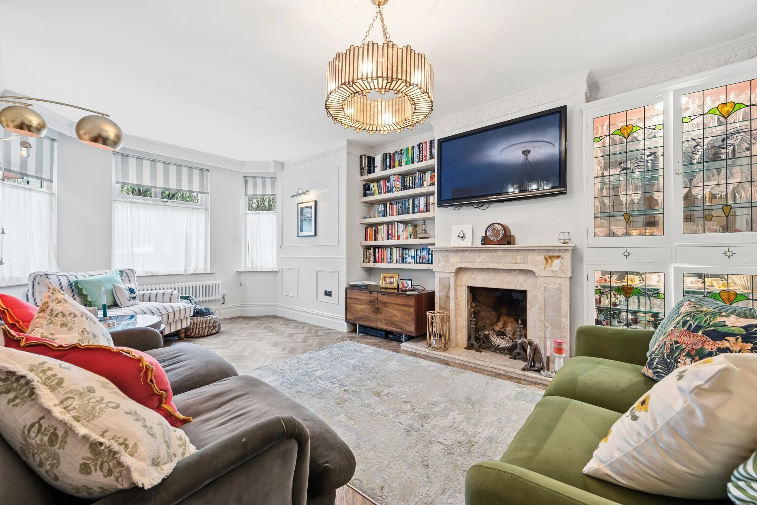 Sitting Room to fireplace and windows.jpg