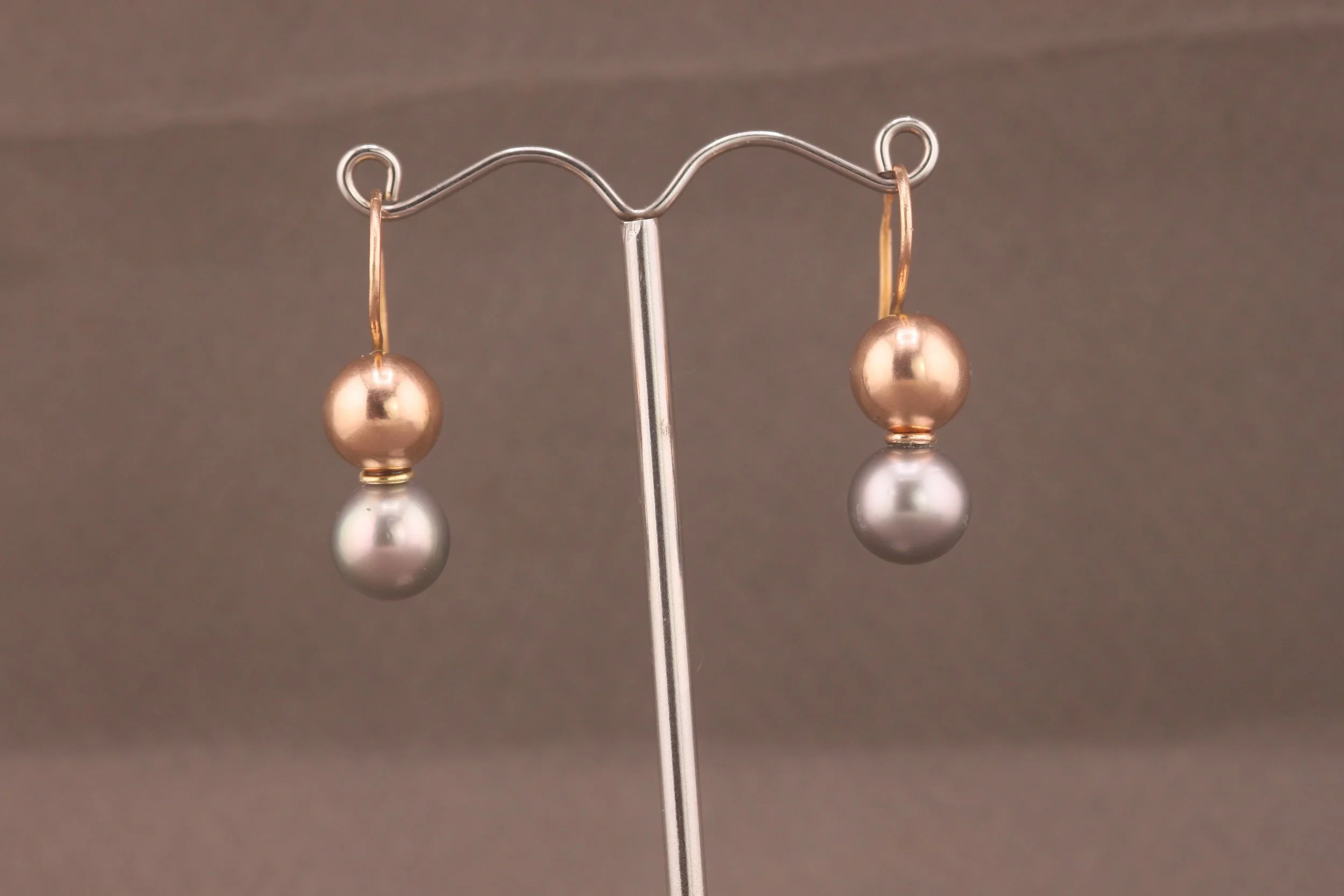 Pearl and rose gold drop earrings created from inherited black pearls as part of a bespoke jewellery remodelling project in my East London studio