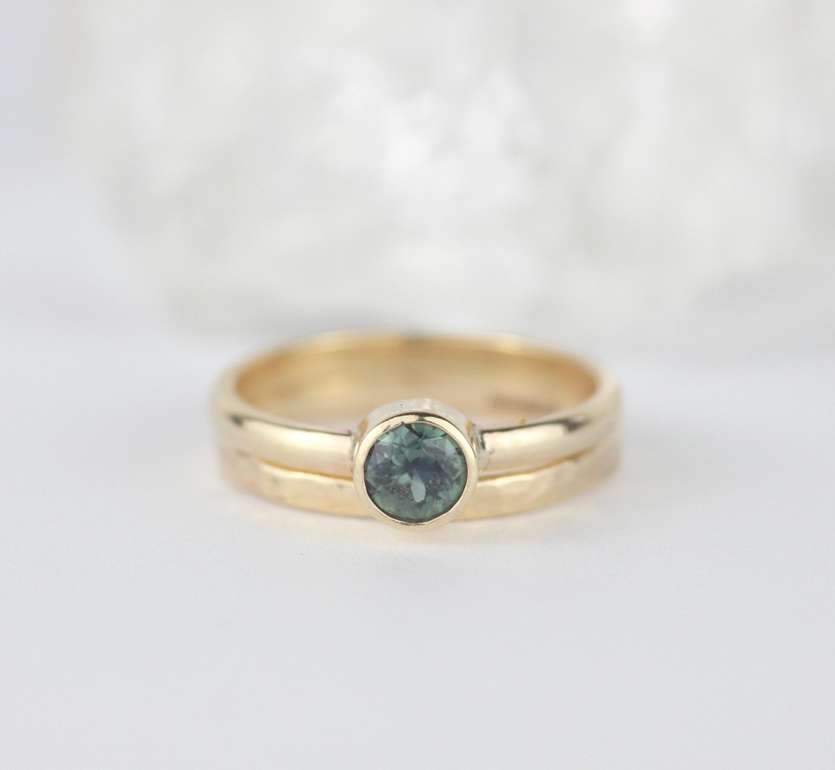 slim hammered yellow gold dainty ring with yellow gold round faceted green sapphire ring