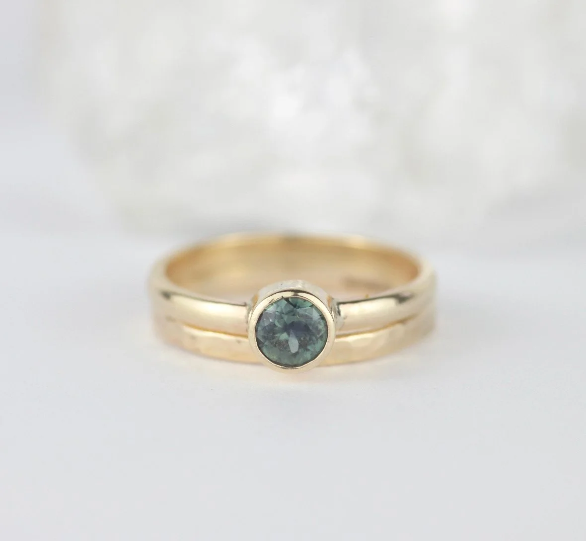 slim hammered yellow gold dainty ring with yellow gold round faceted green sapphire ring