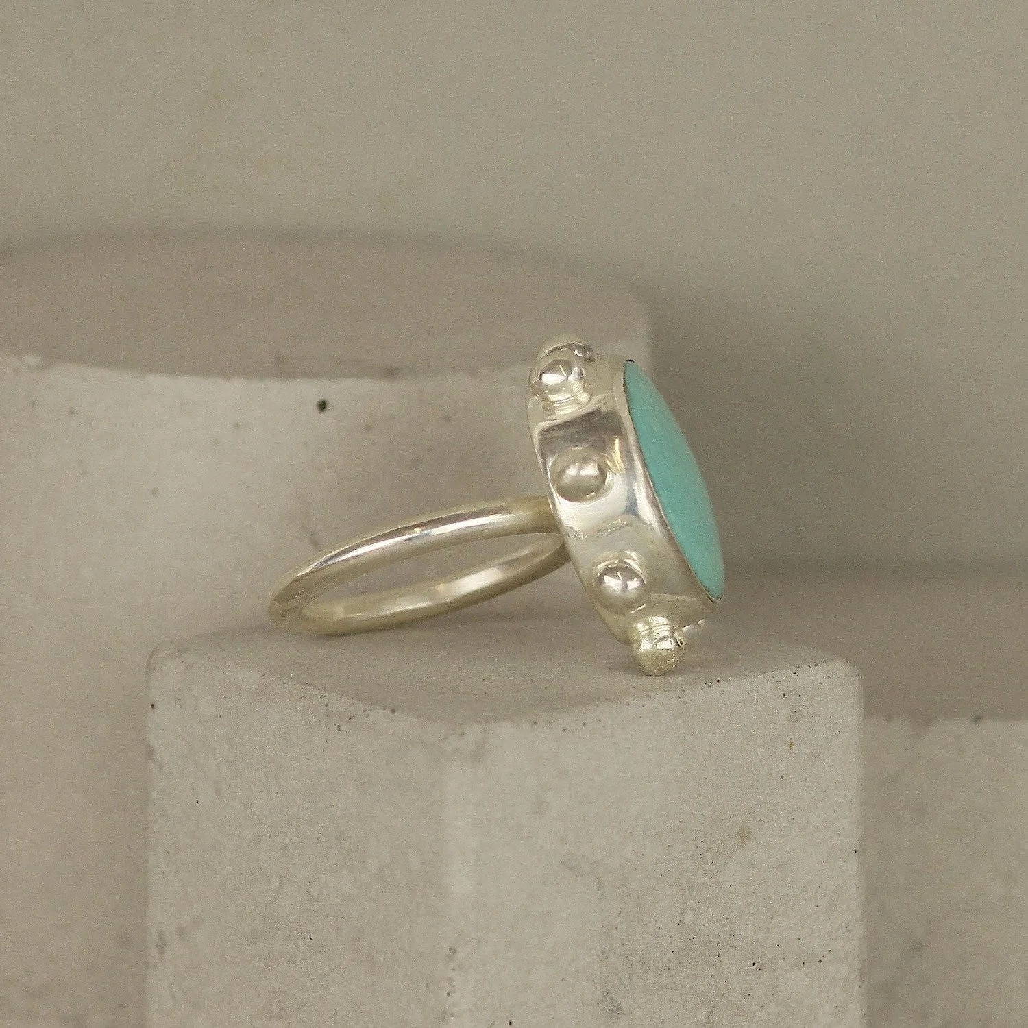 round_turquoise_studded_sterling_silver_ring_.jpg