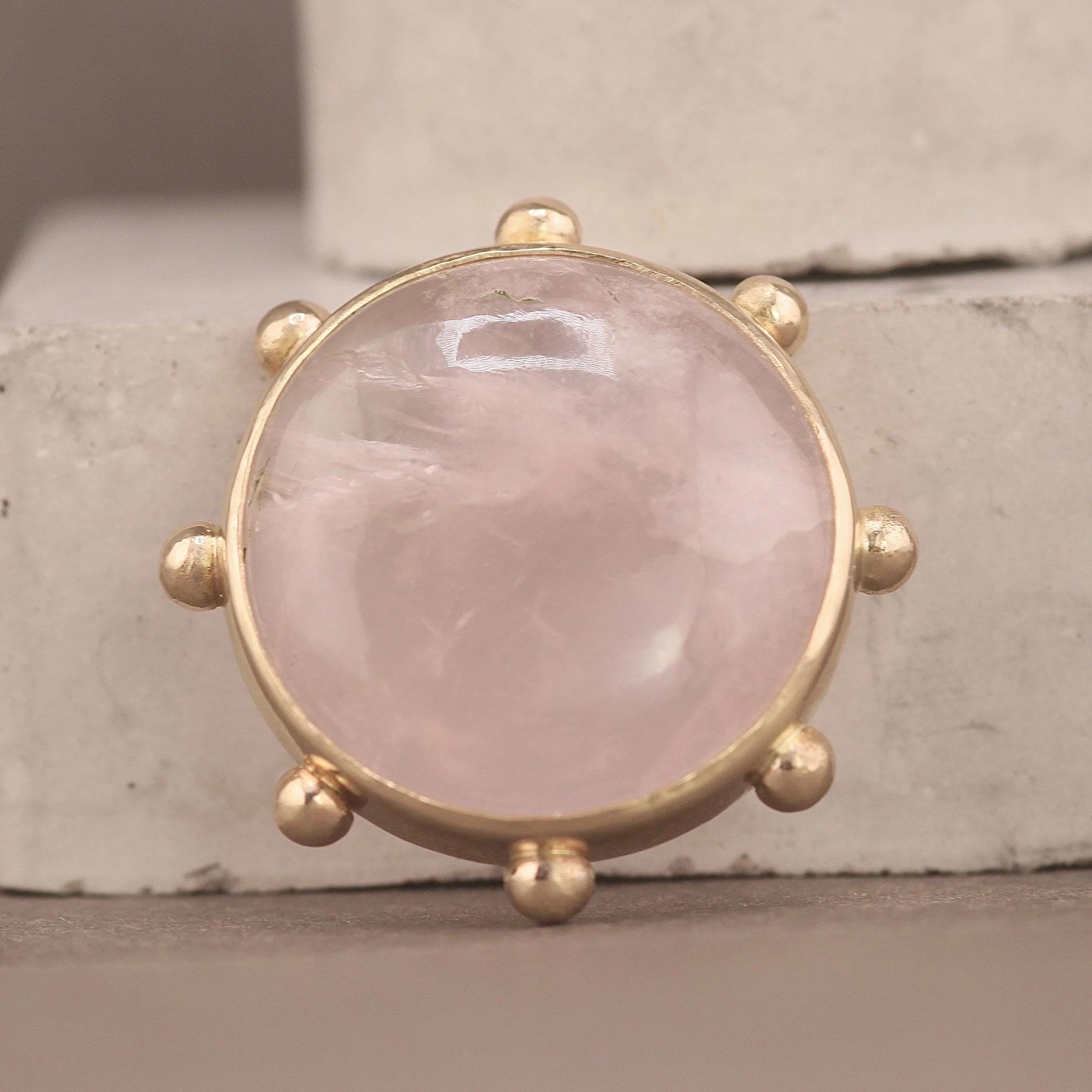 Studded rose quartz pendant in 14ct gold handmade from a client’s original gemstone as part of a bespoke jewellery remodelling project handmade in London