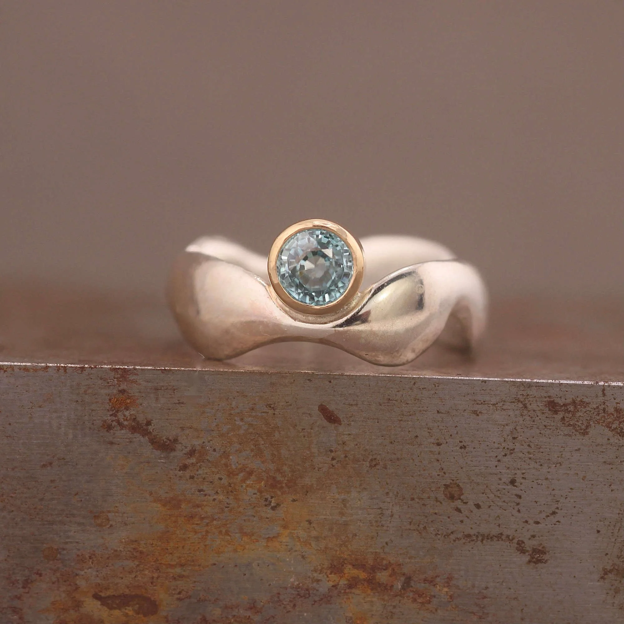 Blue zircon silver 9ct gold round wavy surrealist ring.JPG