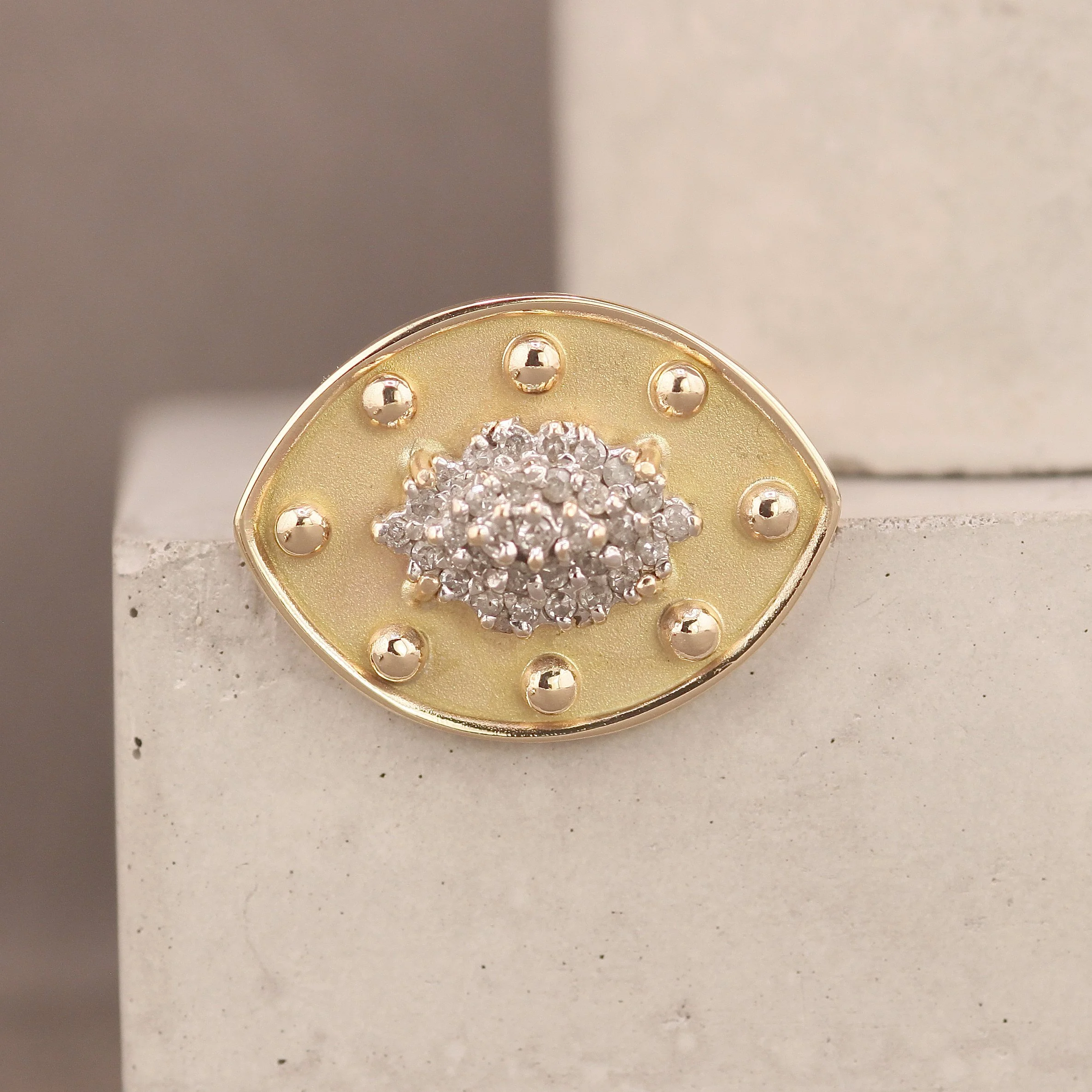 Diamond cluster ring remodelled into a bold contemporary design with prong-set diamonds and studded gold detailing