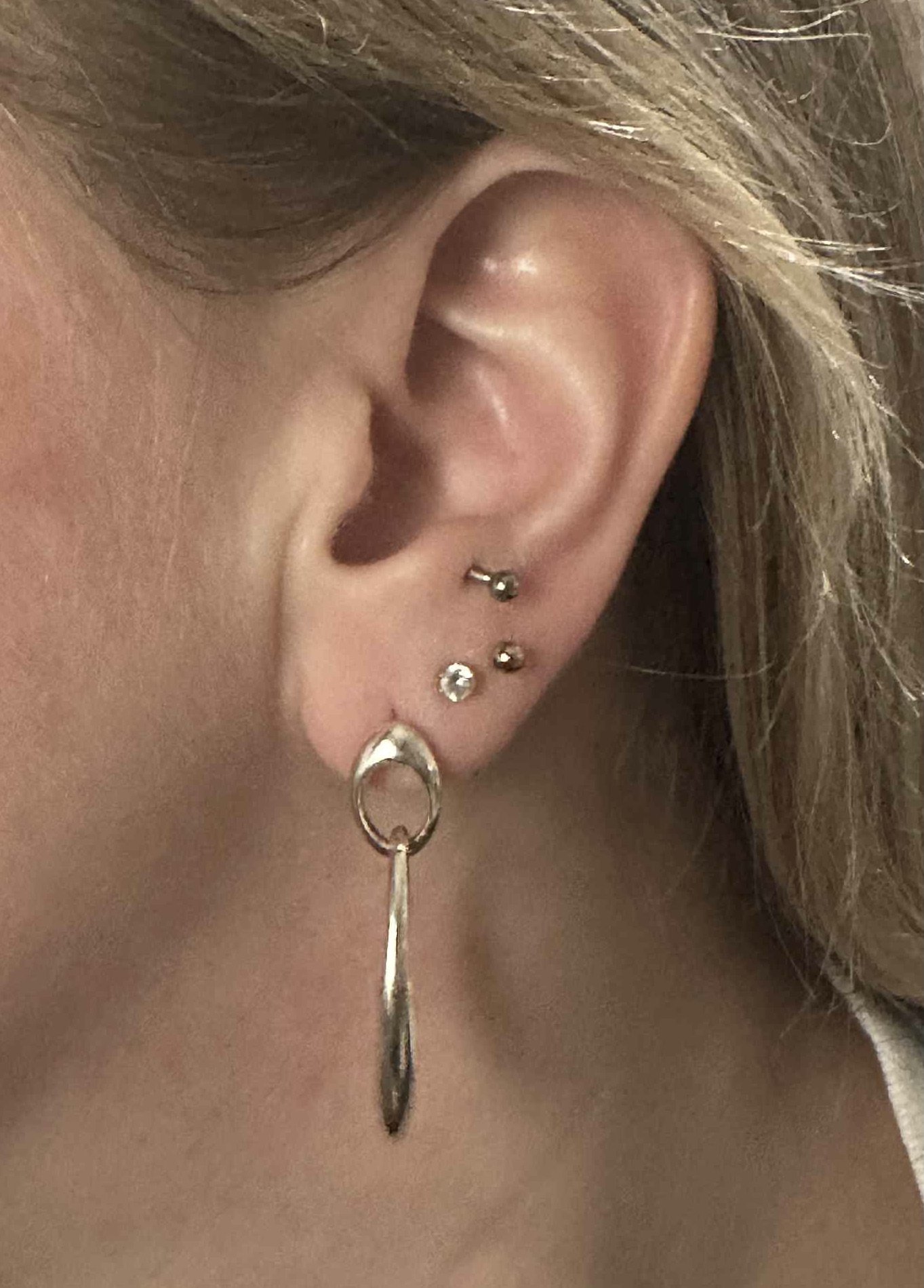 Silver bombe oval earrings modelled.jpeg