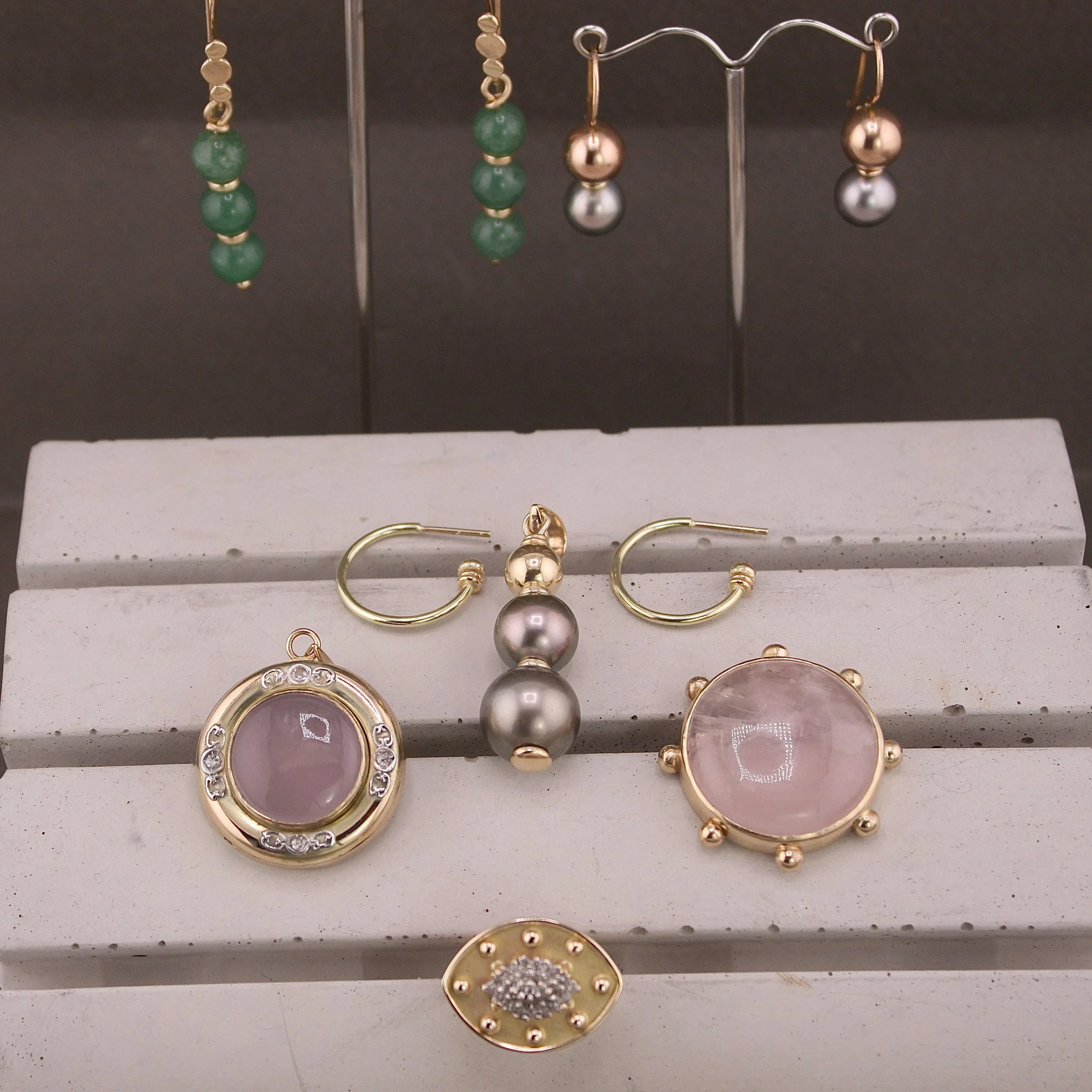 Bespoke 14ct gold jewellery collection created by remodelling inherited pieces, including pearl earrings, rose quartz pendant and vintage watch case pendant, handmade in my East London studio