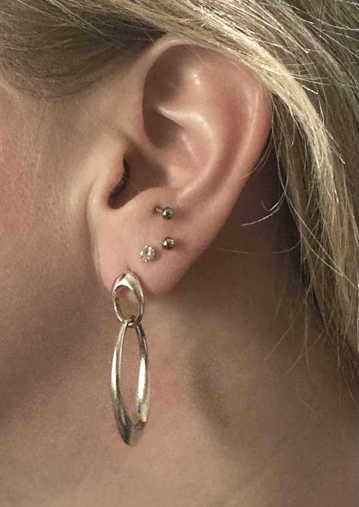 Silver bombe double oval earrings modelled.jpeg