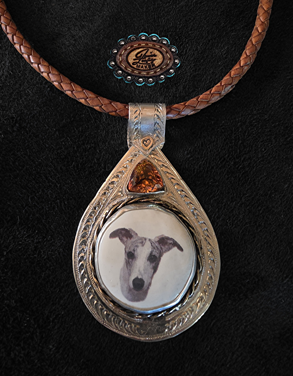 Silver gold pendant w dog and sapphire