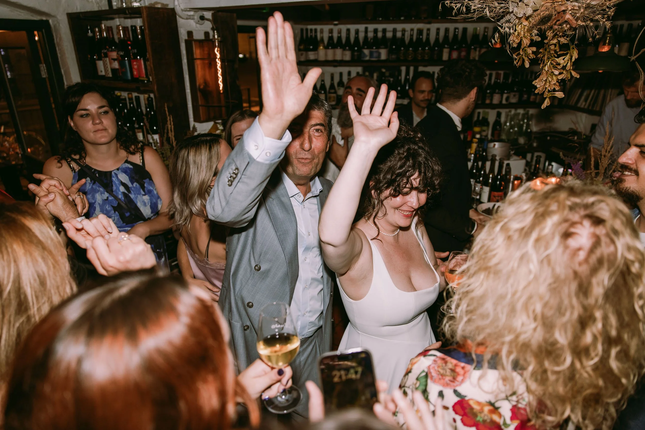 wedding guests enjoying wedding party at bruno wine bar victoria park london