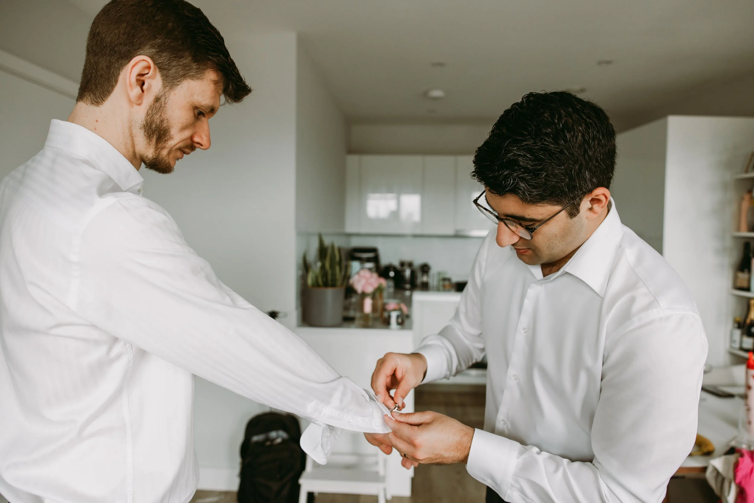 Groom getting ready at home before Hackney Town Hall wedding in London