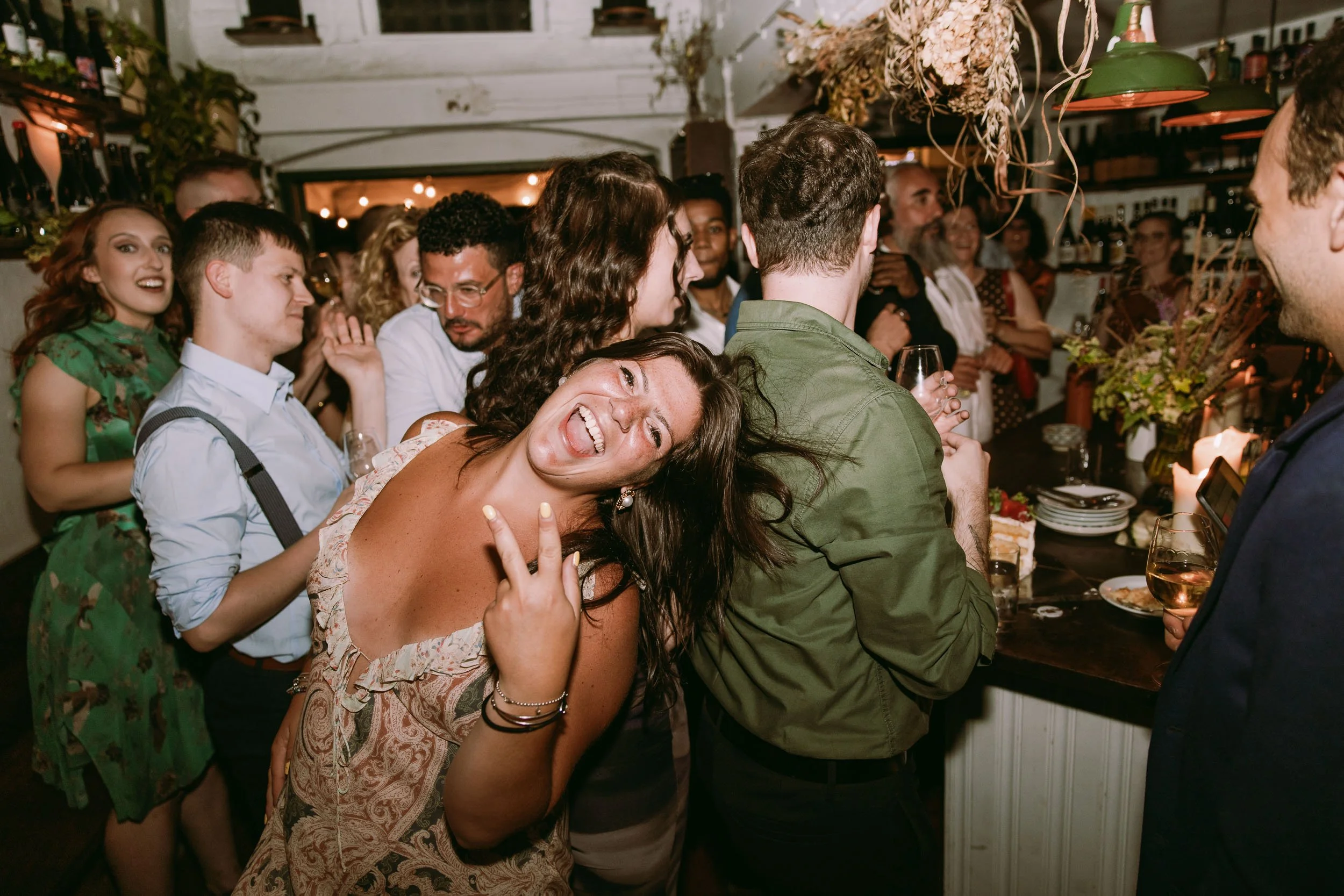 wedding guests enjoying wedding party at bruno wine bar victoria park london