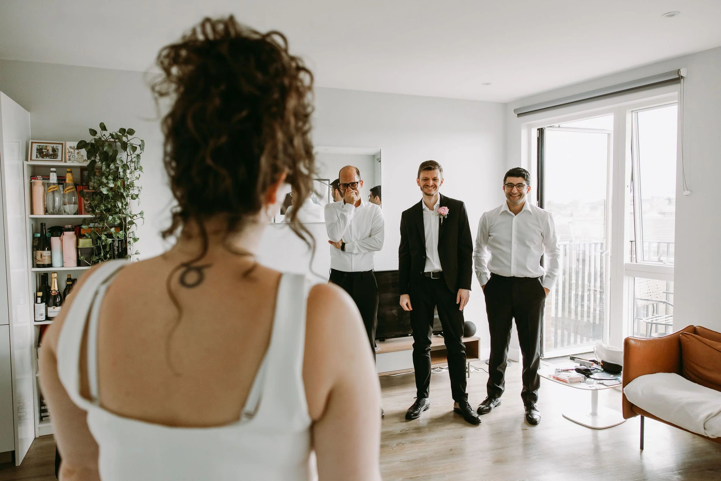 Bride dress reveal at home before Hackney Town Hall wedding in London
