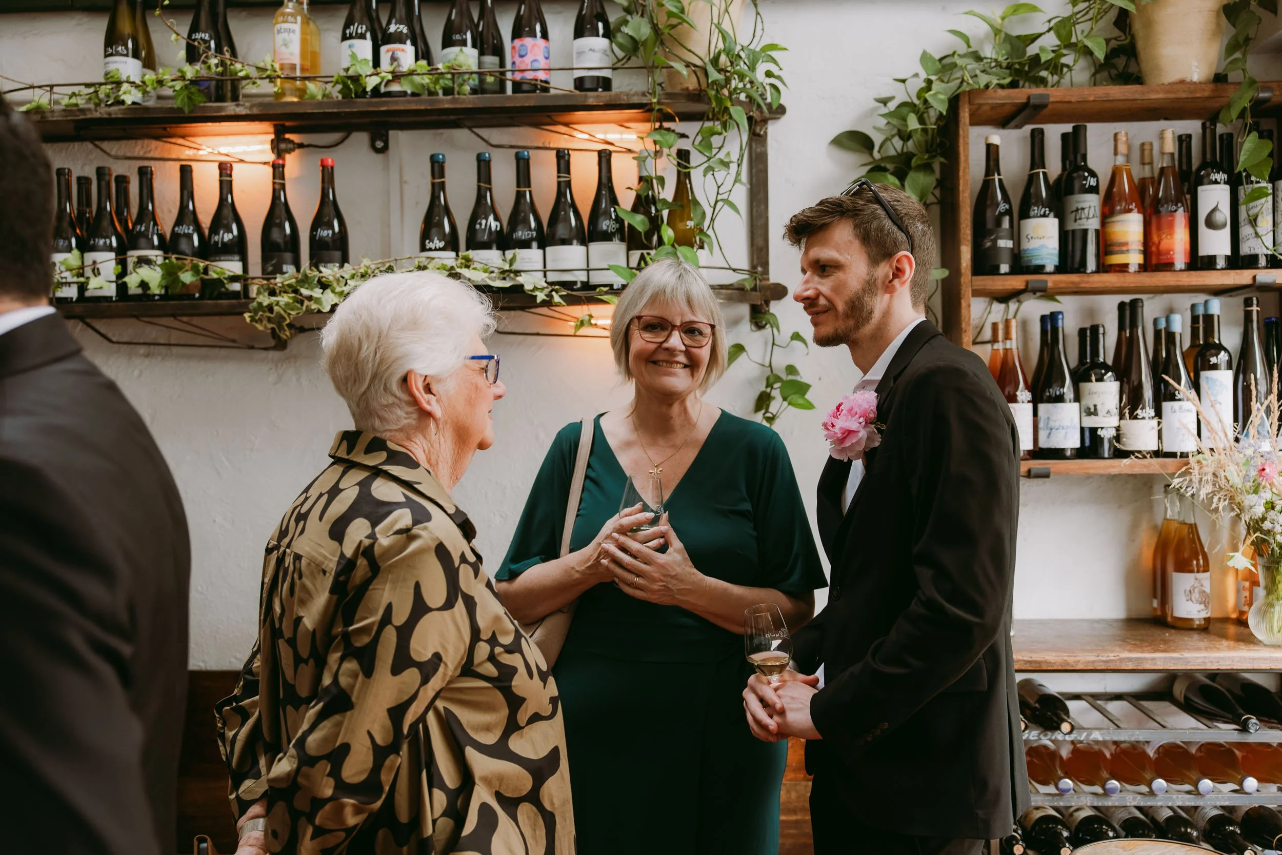wedding guests chatting at wedding reception at bruno wine bar victoria park london