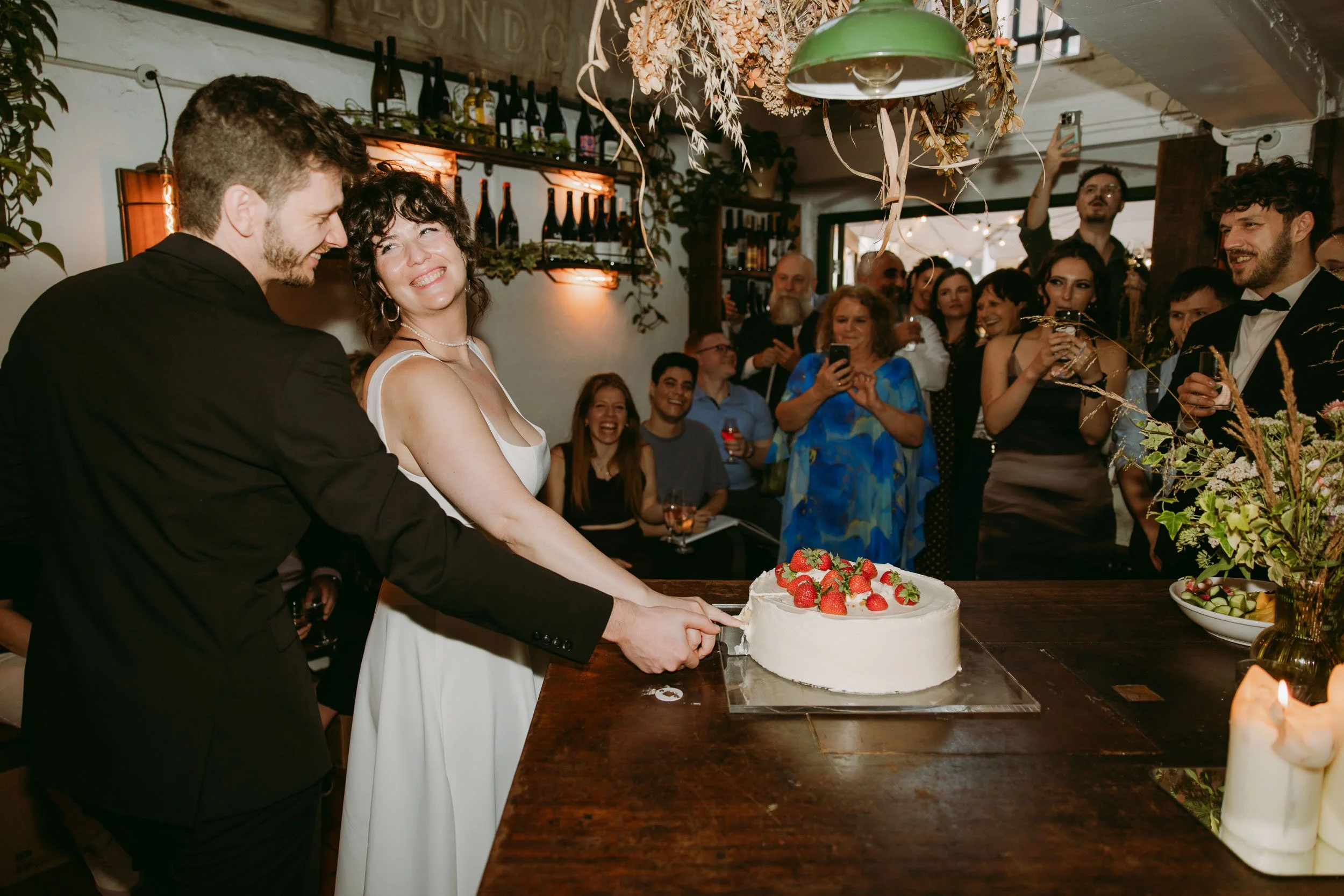 couple cutting cake at bruno wine bar london