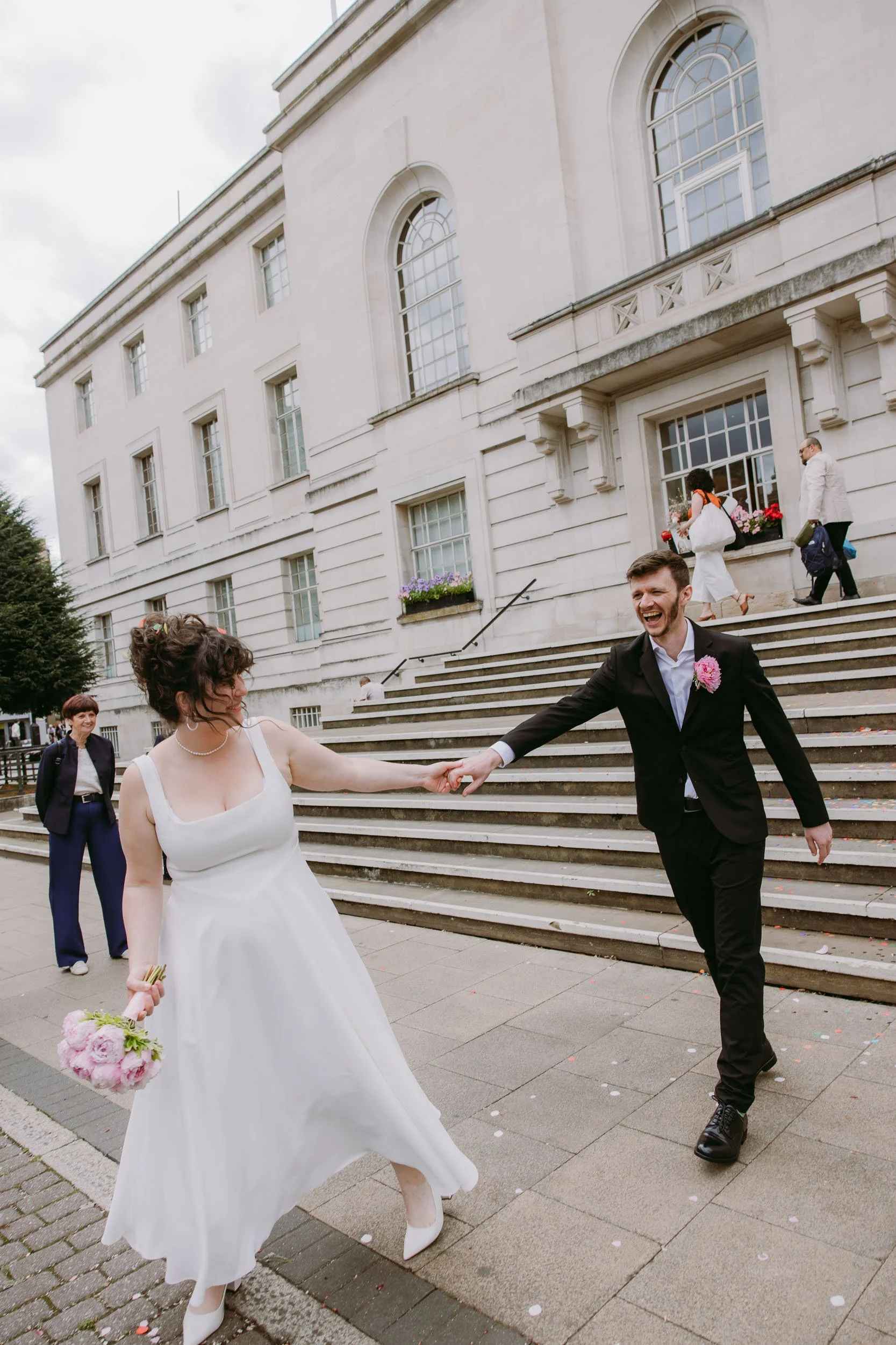 newly wed couple outside hackney town hall east london wedding photographer