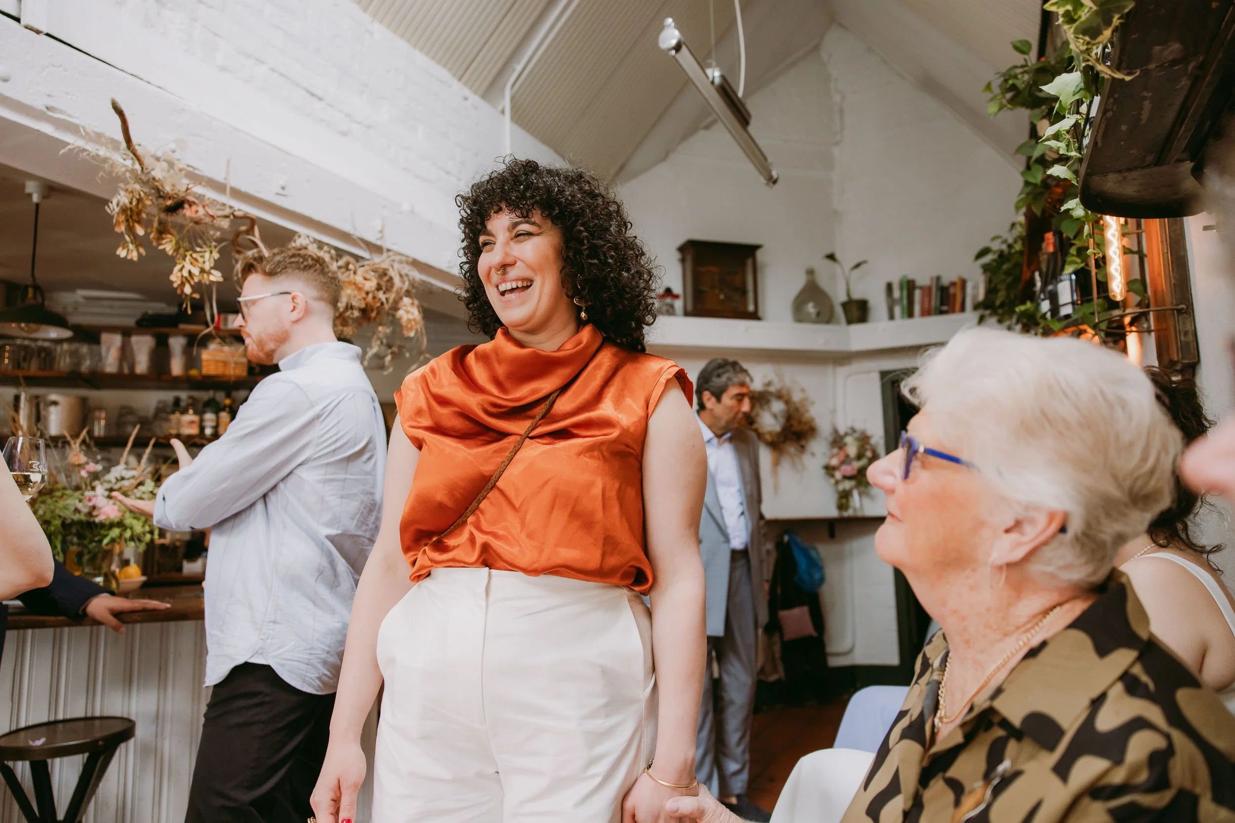 people chatting at wedding reception at bruno wine bar victoria park london