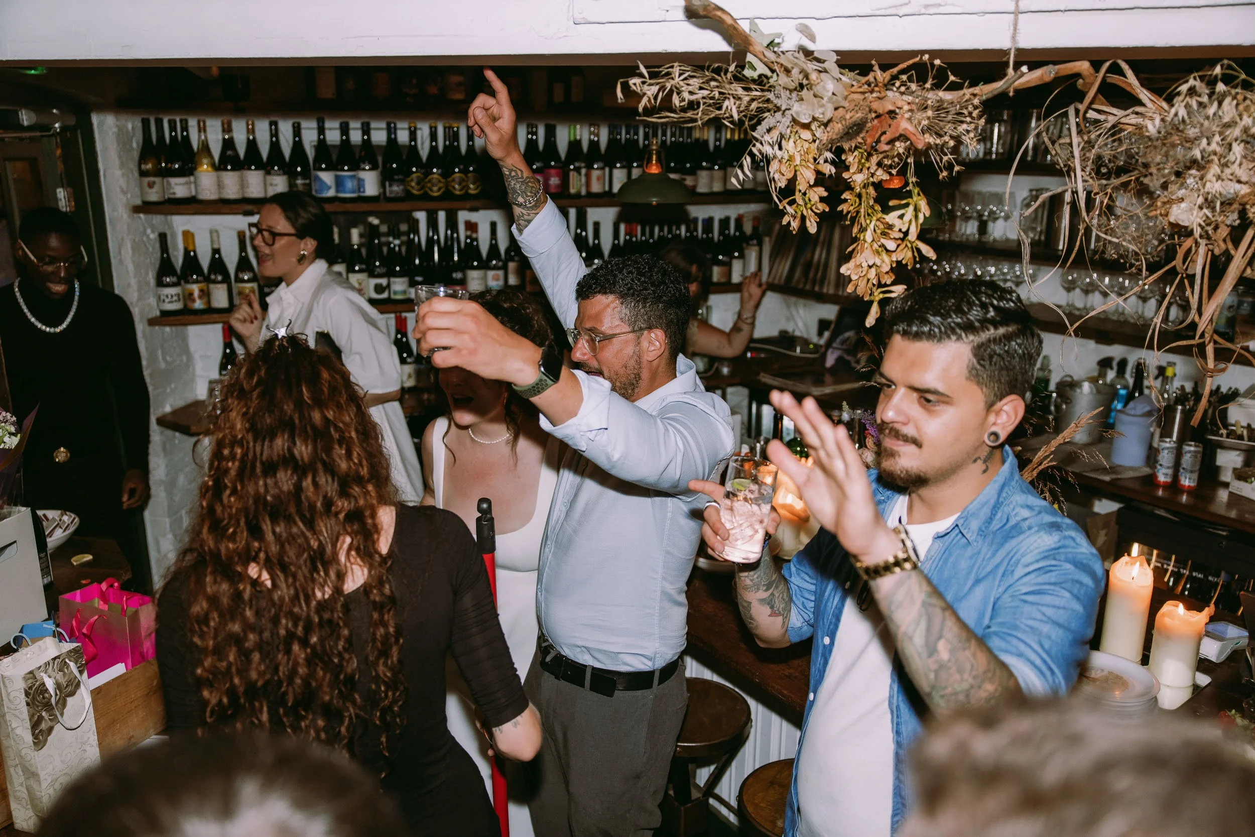 wedding guests enjoying wedding party at bruno wine bar victoria park london