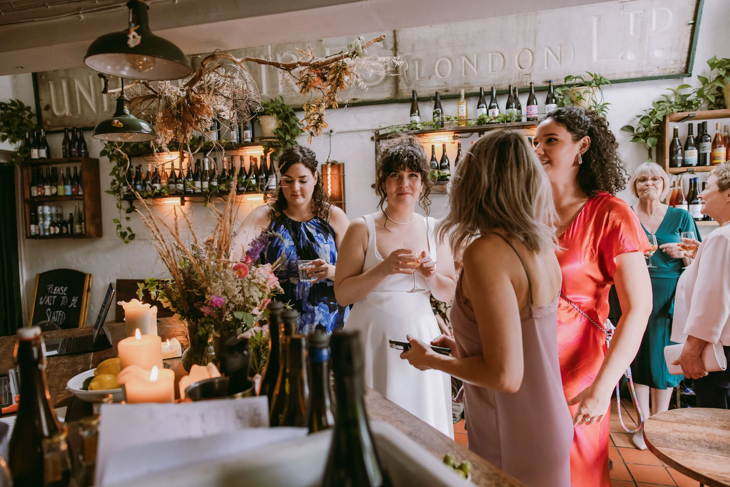 people chatting at wedding reception at bruno wine bar victoria park london