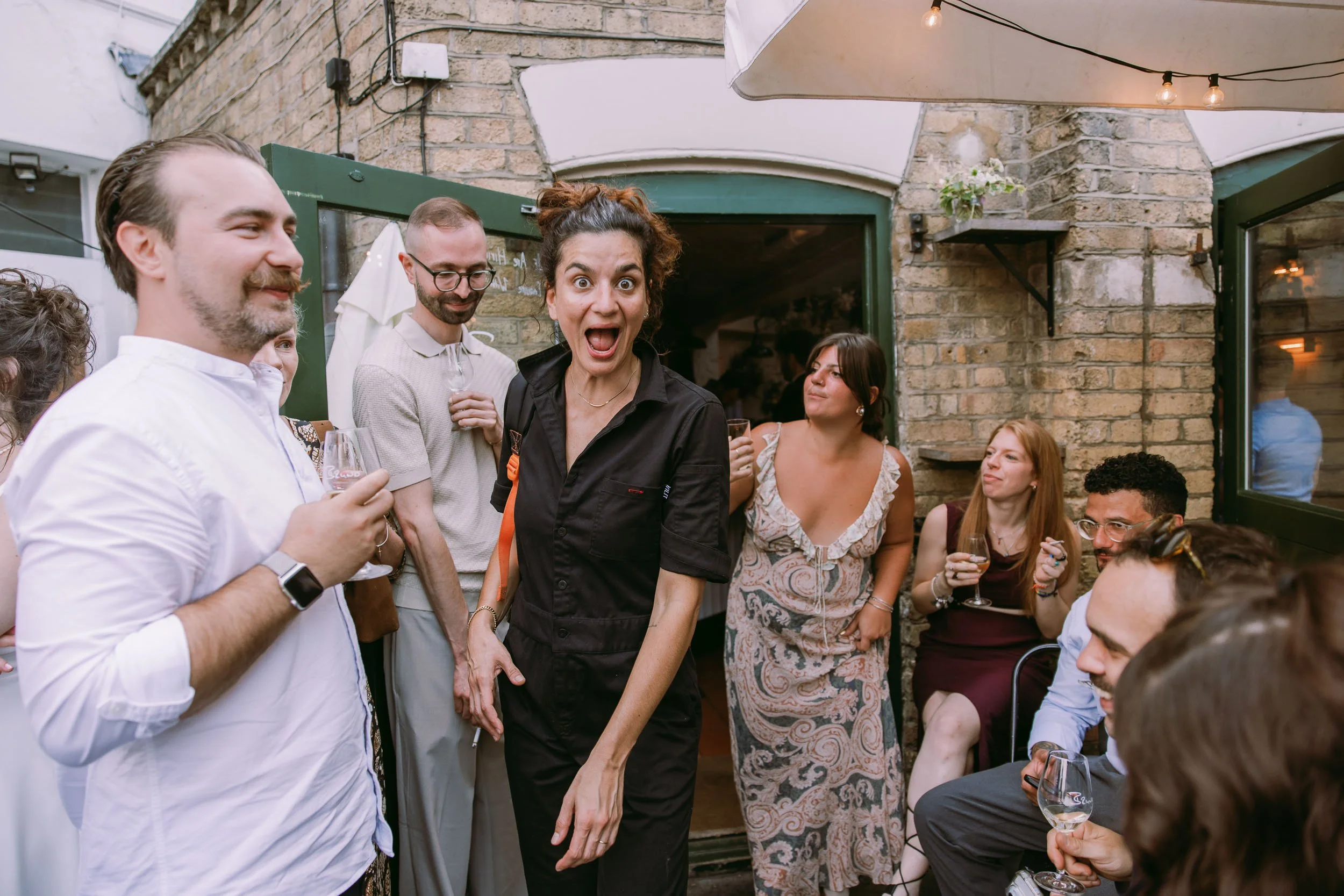 wedding guests enjoying wedding party at bruno wine bar victoria park london