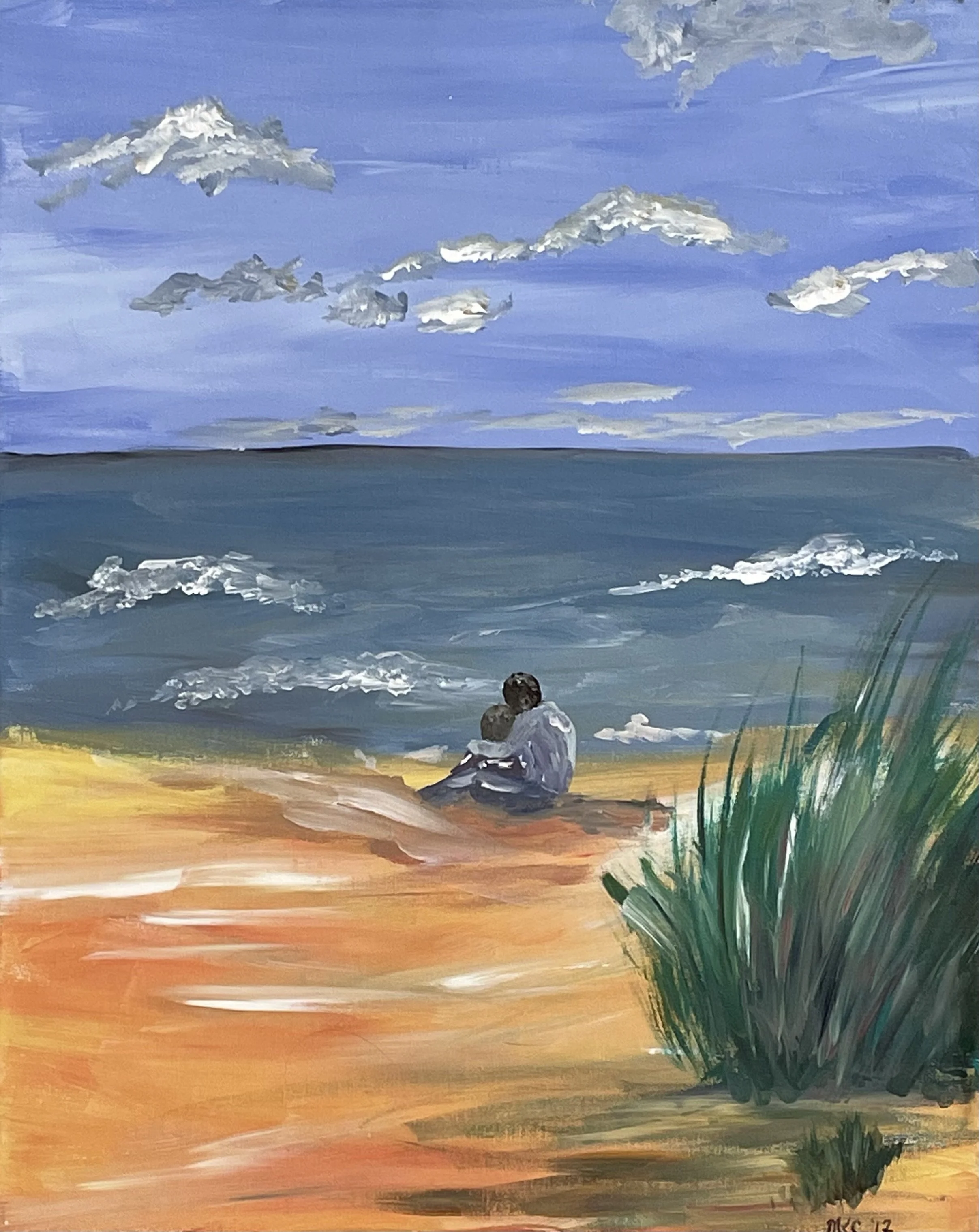 a couple snuggling at the beach