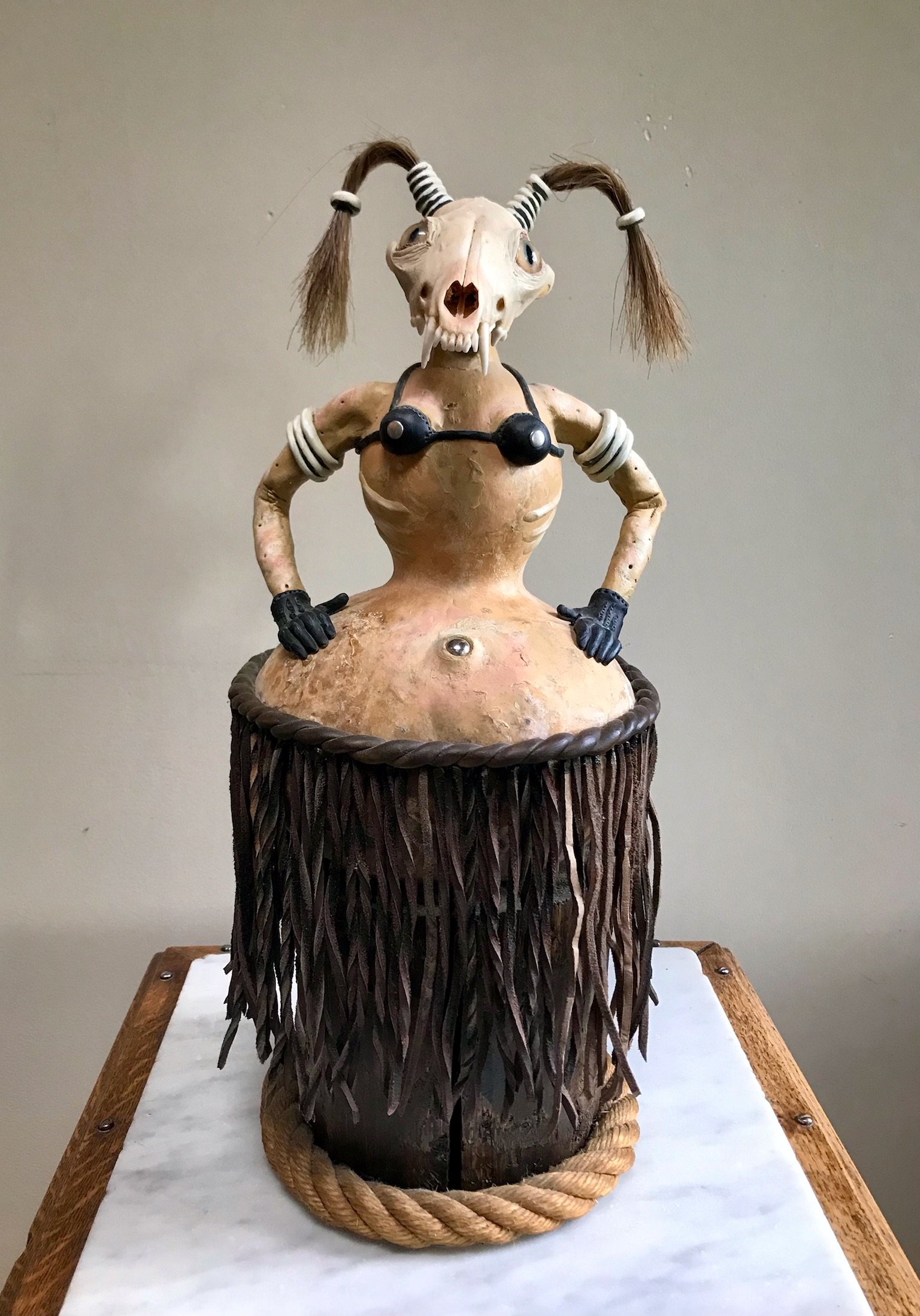 Hula Girl, 18" Mixed media, gourd, wood, acrylic, epoxy, found animal skull, glass eyes, horse hair, - SOLD