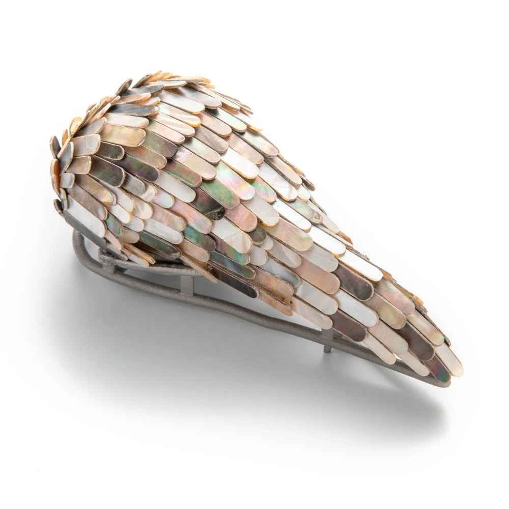 Evert-Nijland-jewellery-still-life-bird-brooch-mother-of-pearl-side-view.jpg