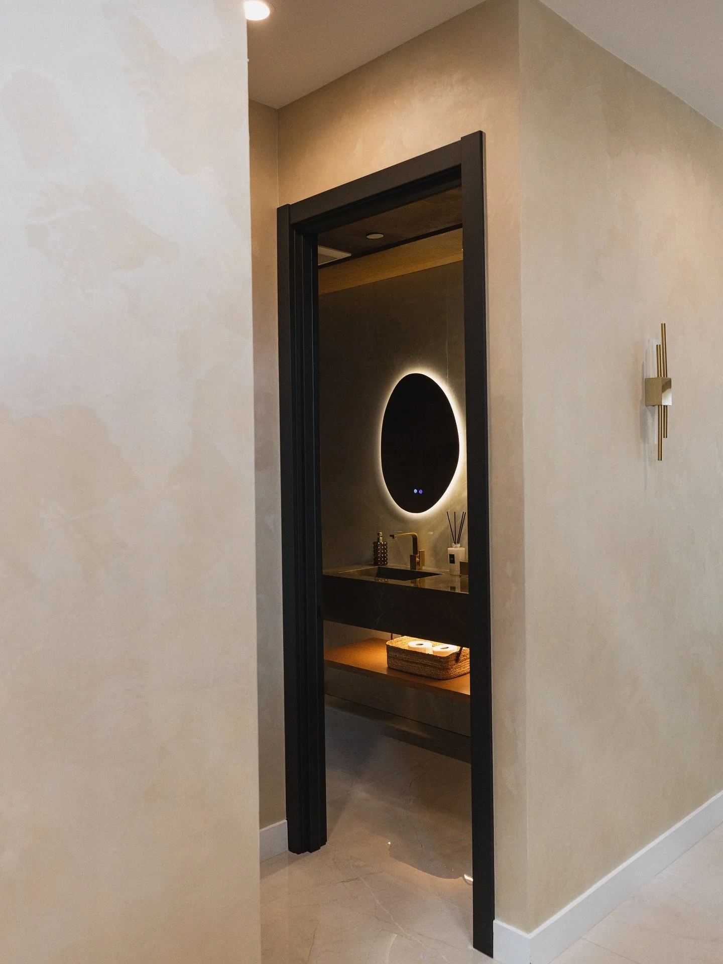 Powder rooms are the jewels of a home, and this one was designed to make a statement. The full remodel celebrates refined details, dramatic lighting, and rich finishes that transform a simple necessity into an experience. Kitchens and powder rooms ar