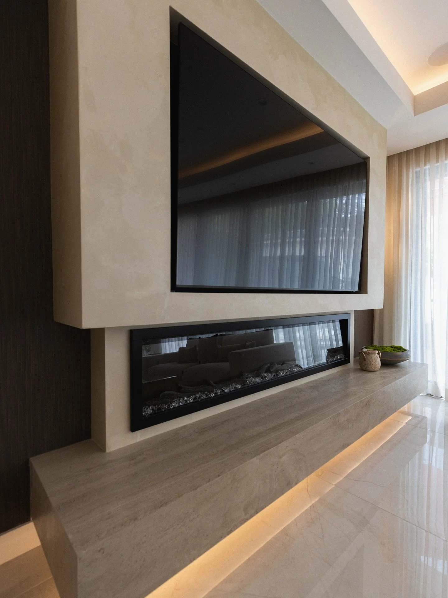 Fireplaces are more than ambiance, they&rsquo;re architecture 📐 In this remodel, the fireplace was designed as the anchor of the living room. Beyond adding warmth, it defines the scale of the wall, integrates with the media unit, and establishes pro