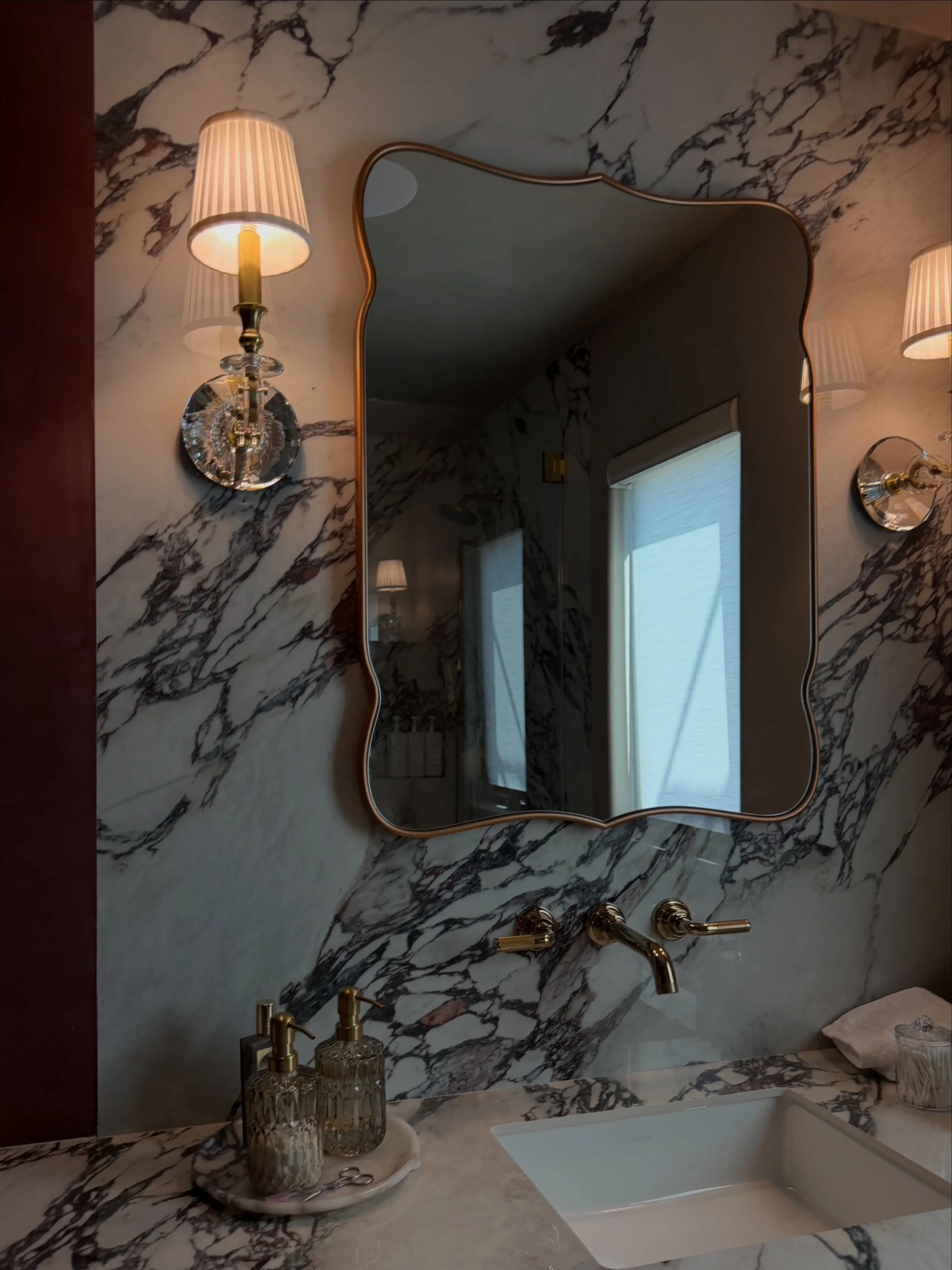 One of the bathrooms from our recently completed full house remodel, designed for our client&rsquo;s daughter.

She wanted a Parisian feel, so we leaned into richer materials and a little more romance while still keeping the space clean and current.
