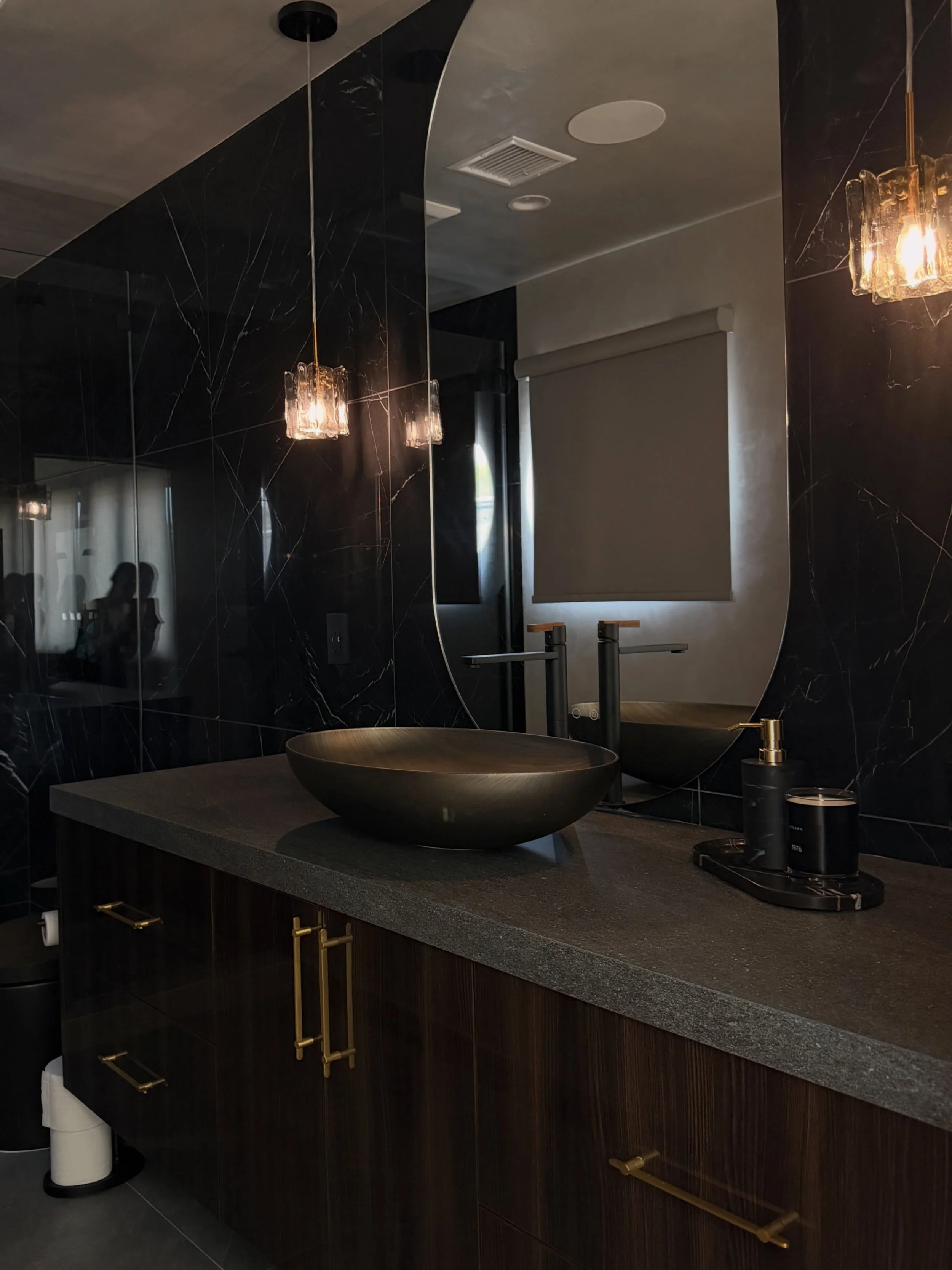 The junior suite, reworked from the inside out.

We expanded and reshaped the room, redesigned the closet, and carried the vision through every detail of the bathroom and bedroom, including the custom vanity and built-in closet. Dark stone, high-glos