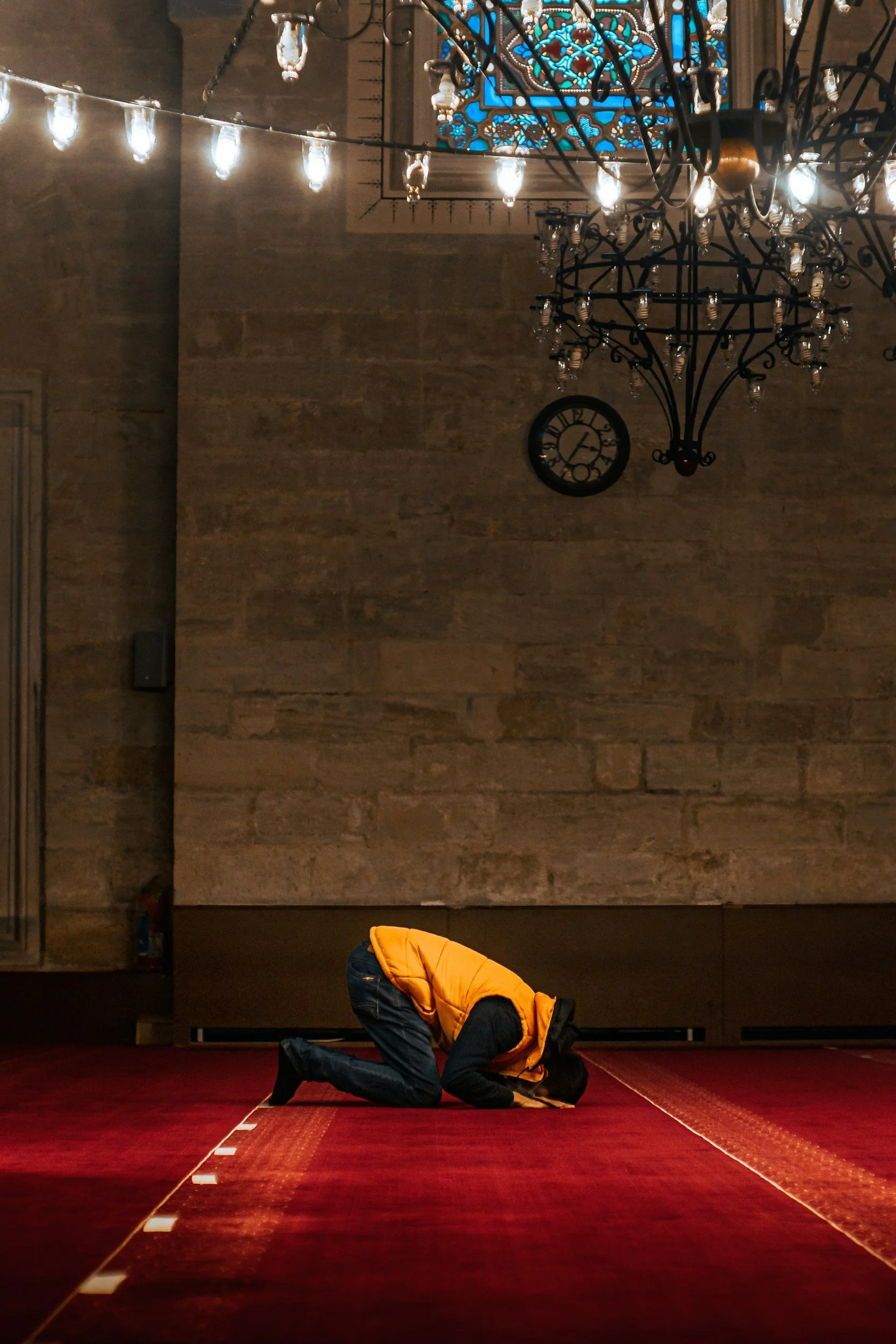 Man praying in a mosque.