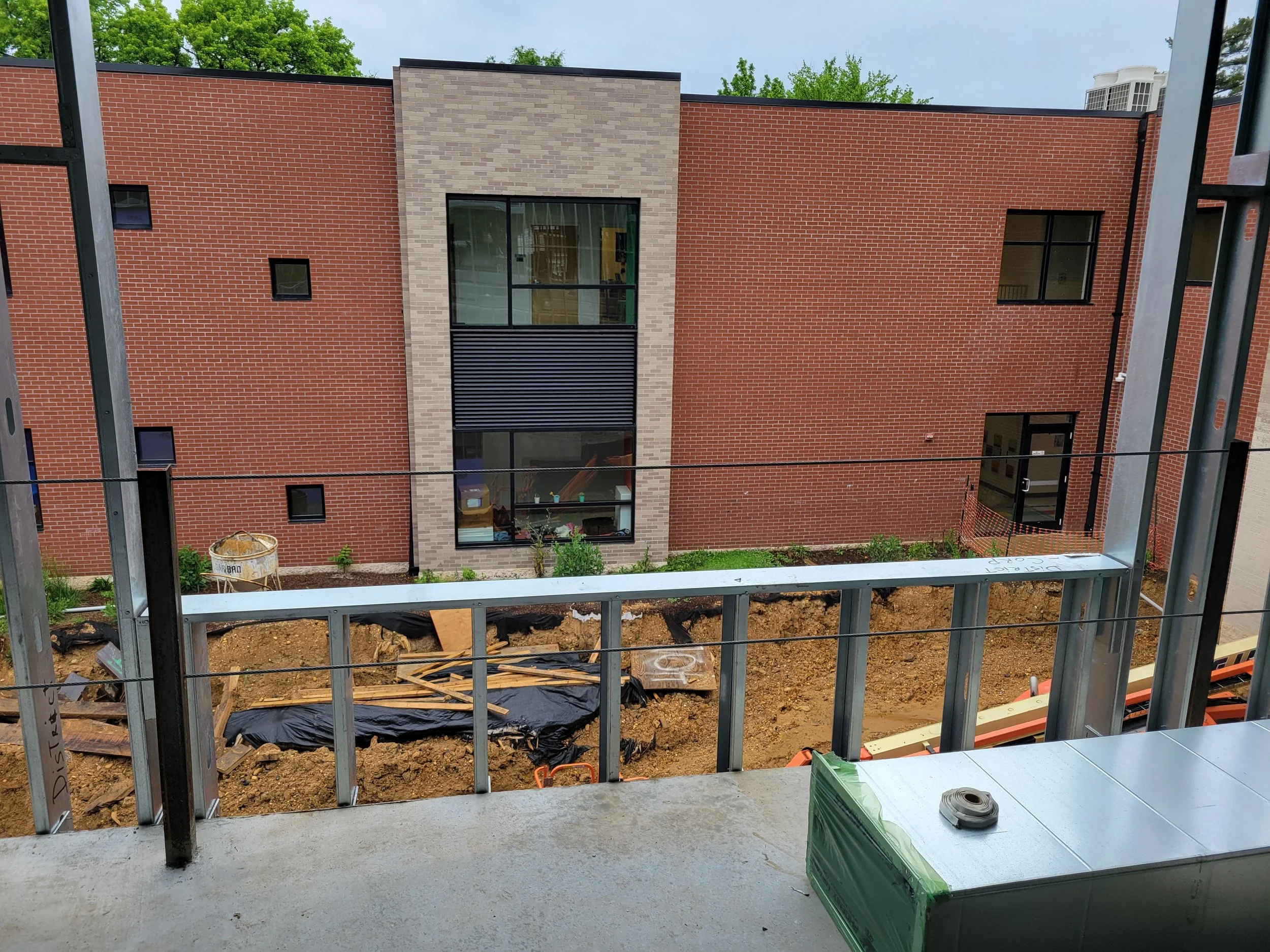 View from 2nd floor hallway towards existing building (May 14 2024)