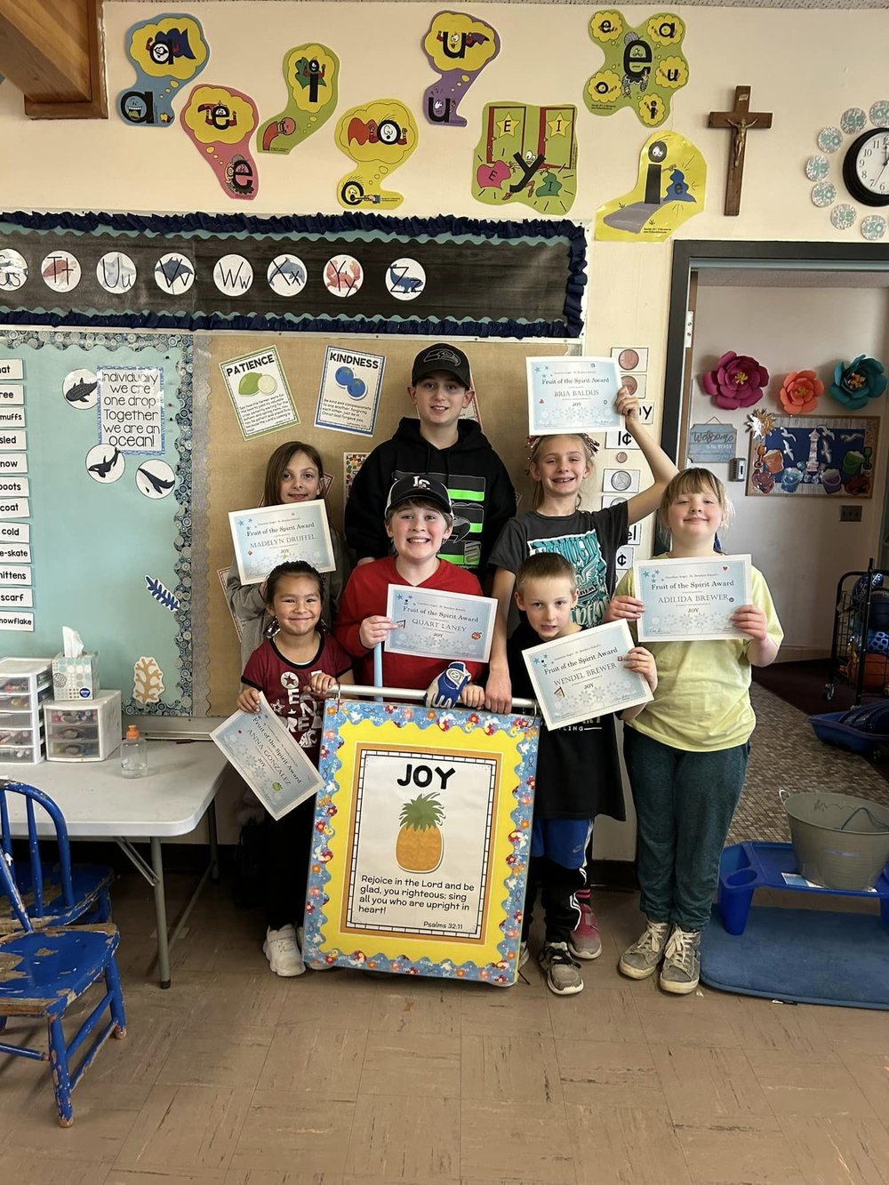Guardian Angel-St. Boniface students show their newly minted Fruit of the Spirt Awards, in Colton, WA