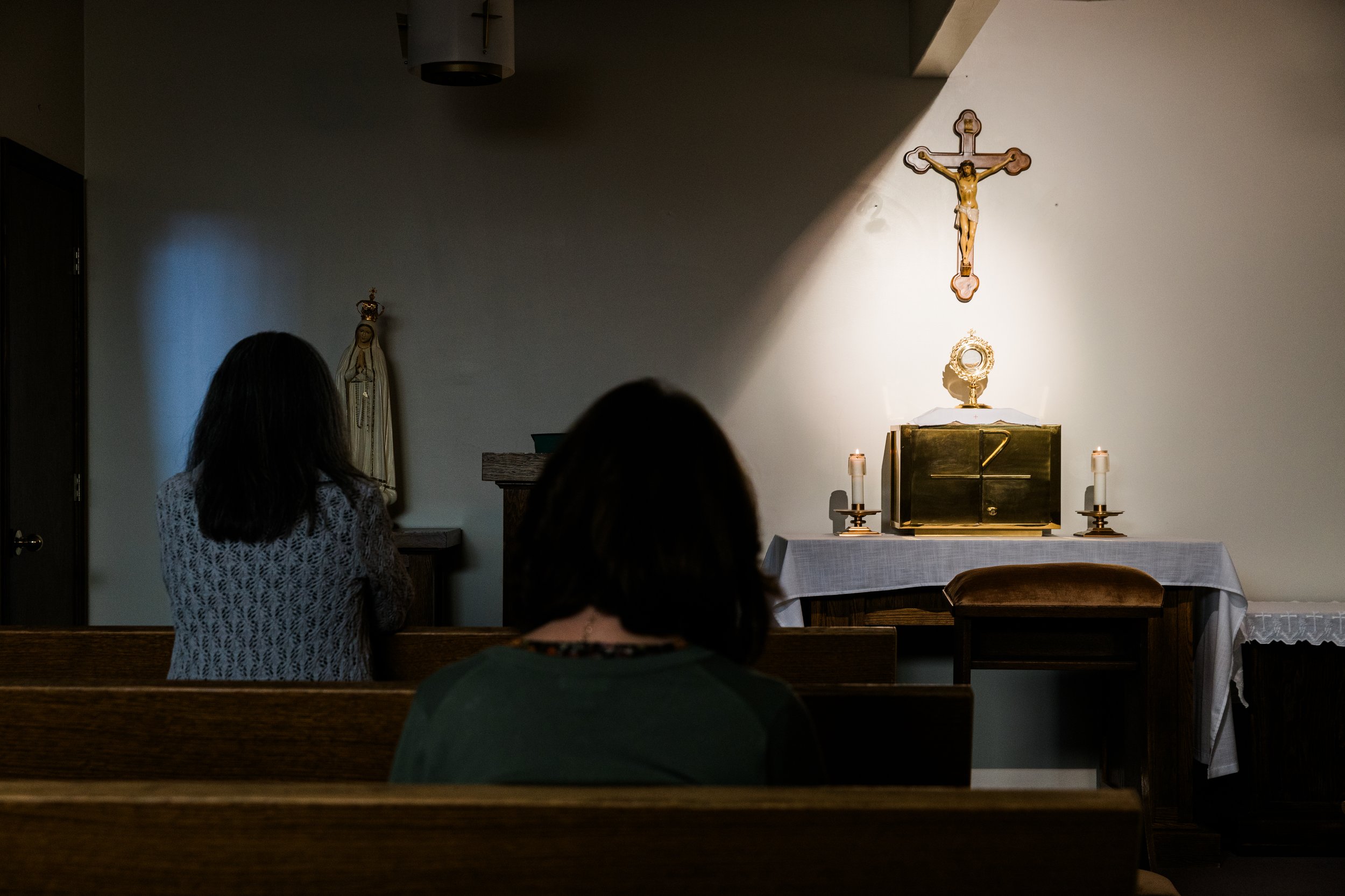 Teachers spend time in adoration at St. Charles School. 