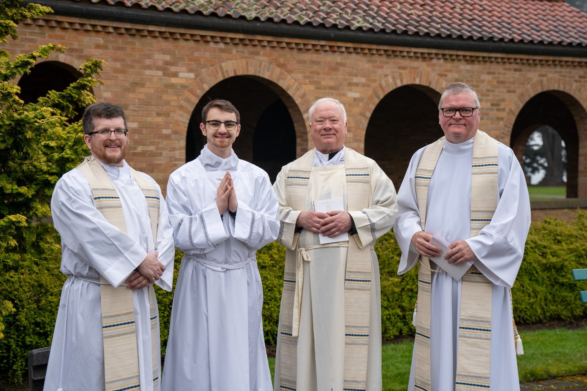 (L-R) Father Andrew O'Leary, Nathan Loe, Father Eugene Tracy, Father Darrin Connall.