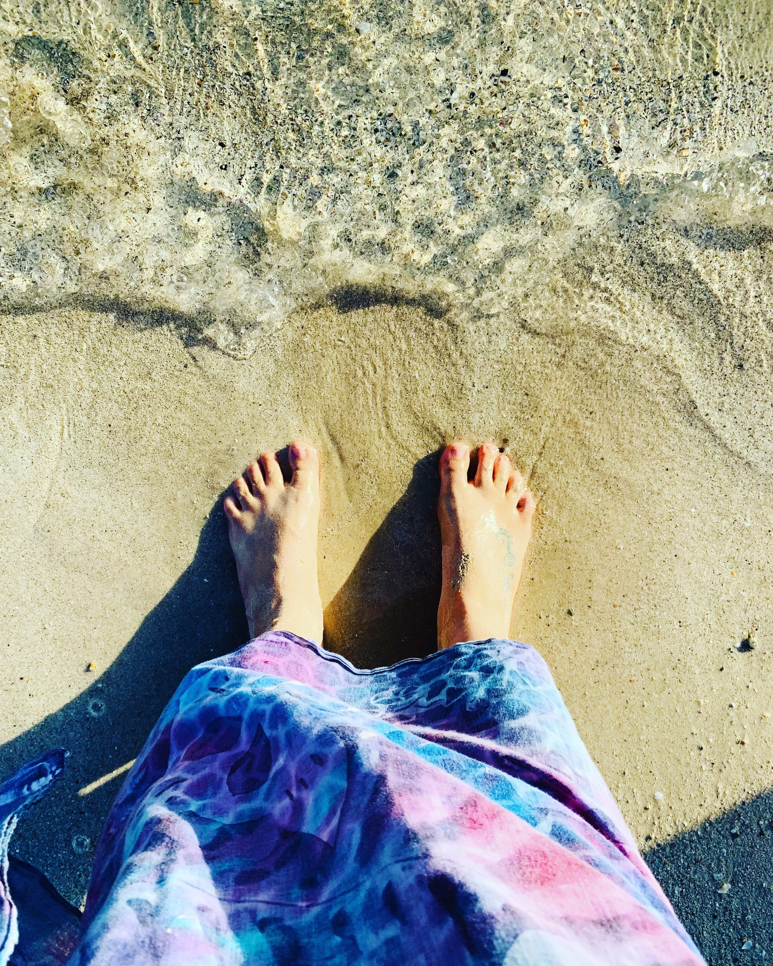 Yve Hart feet on the ocean shore