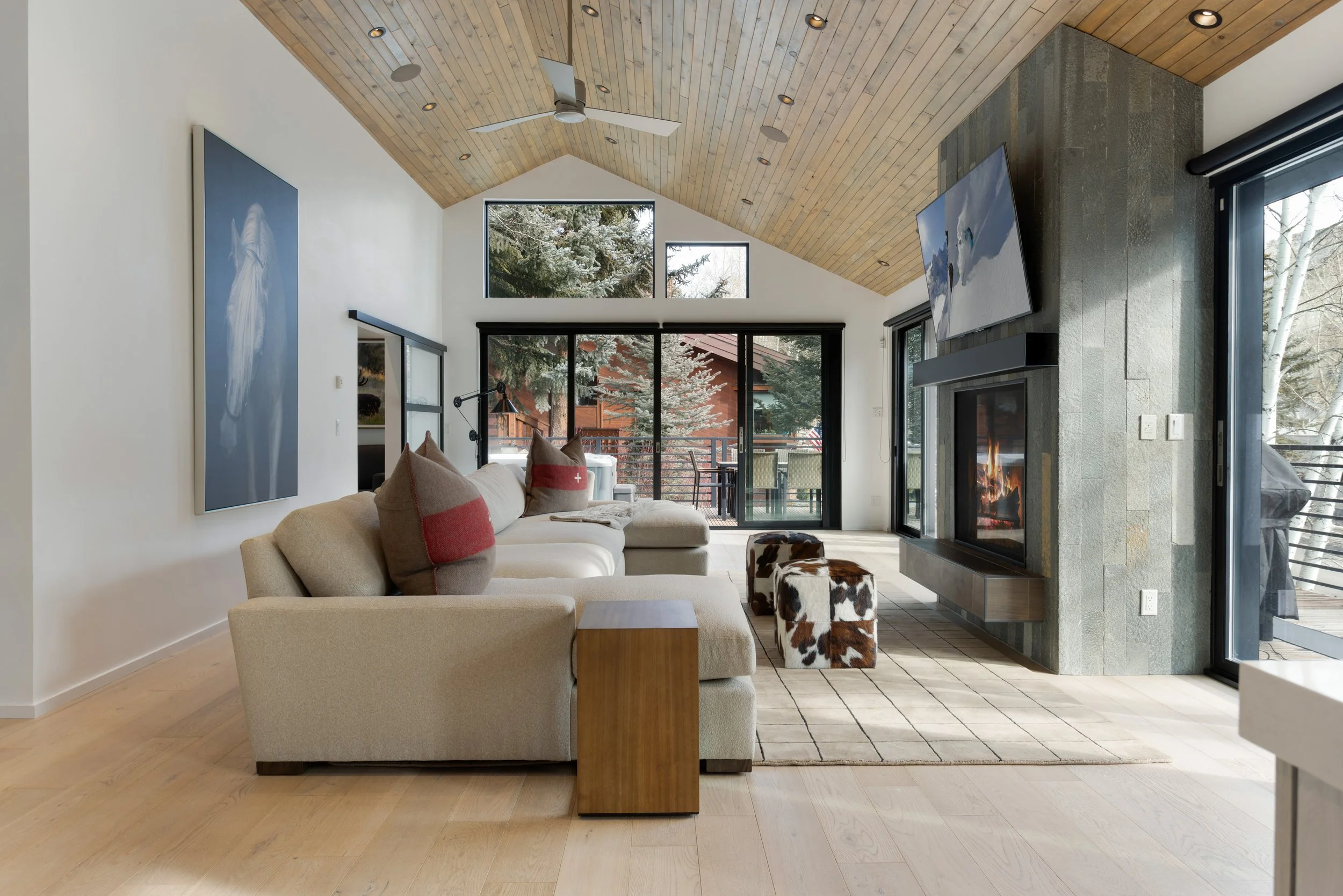 luxury living room with gas fireplace and mountain views