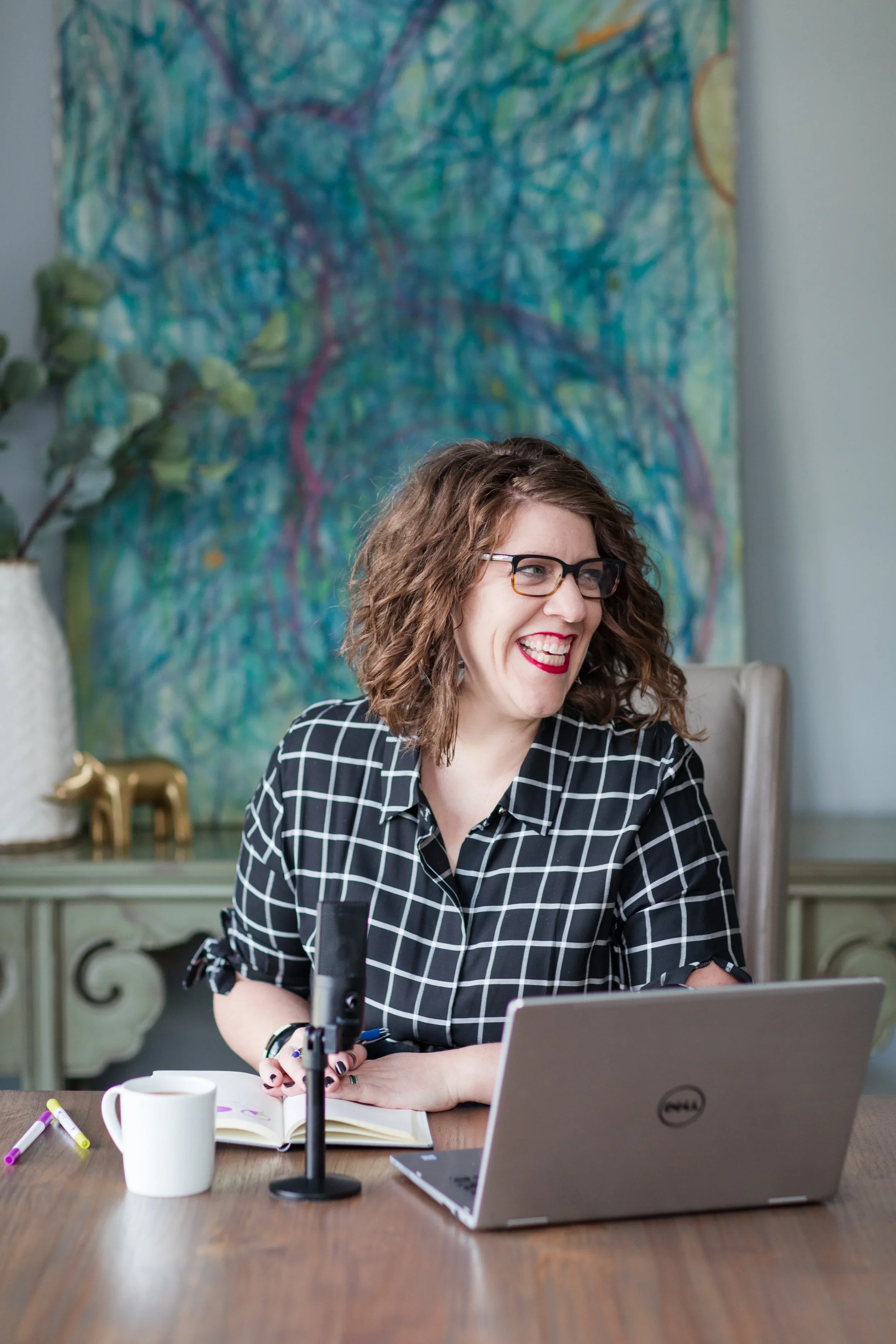 Sherry Quam Taylor in front of her computer