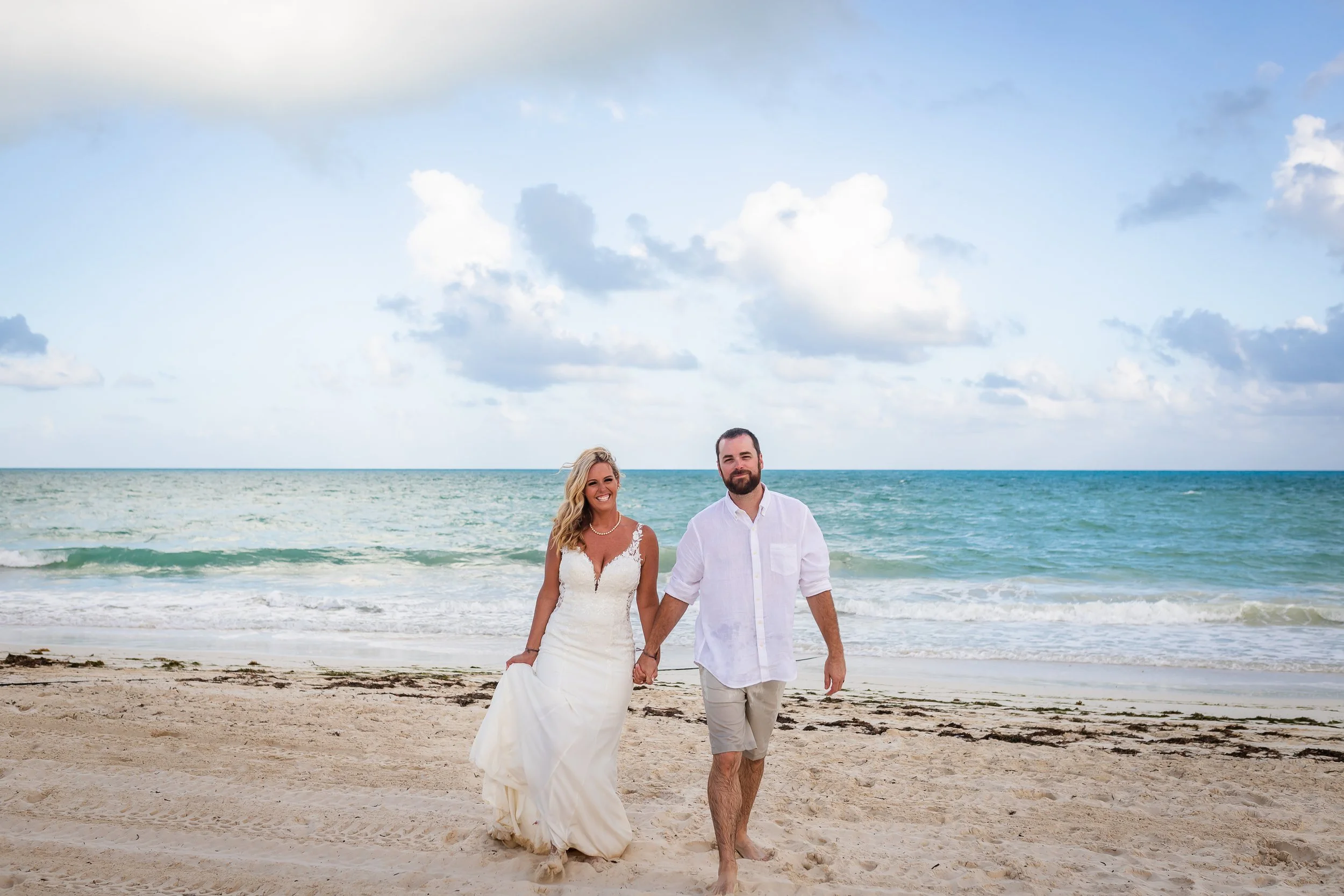 Couple walking on beach.jpeg