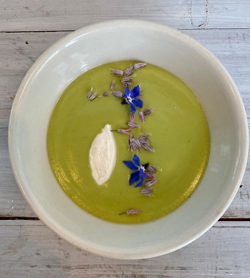 Asparagus Soup with creme fraiche and olive oil. Order online or in store at Star Provisions. Link in bio to order ahead.