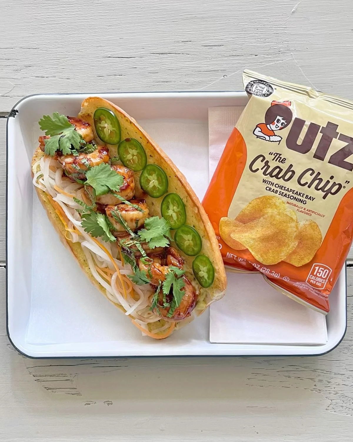 The Shrimp Banh Mi at W. H. Stiles Fish Camp - lemongrass marinated shrimp, seared and served with pickled roots, jalape&ntilde;o peppers &amp; herbs on a toasted bun!