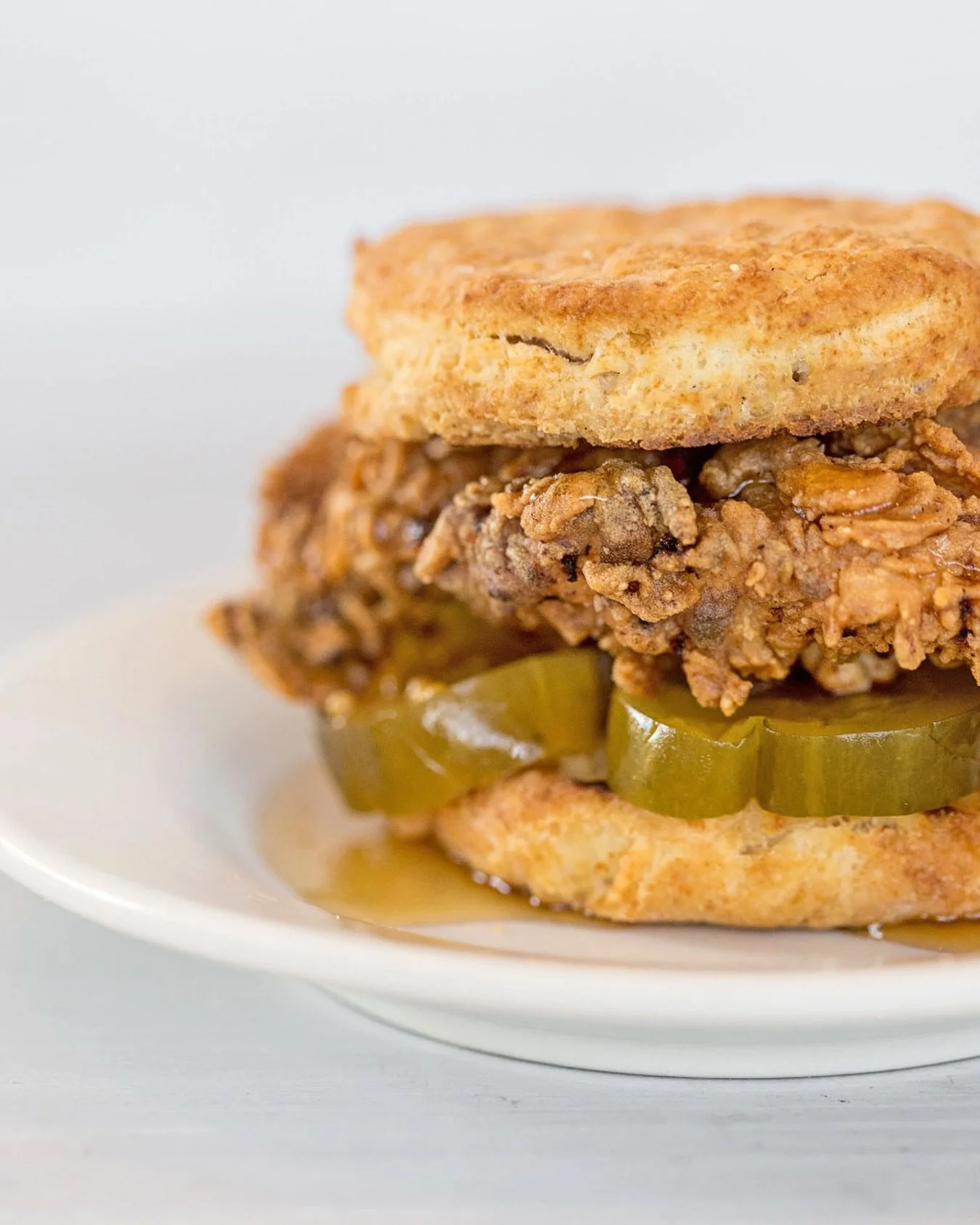 The crispy chicken biscuit with sweet pickles and hot pepper honey - you all keep coming back for this one and we totally get why!