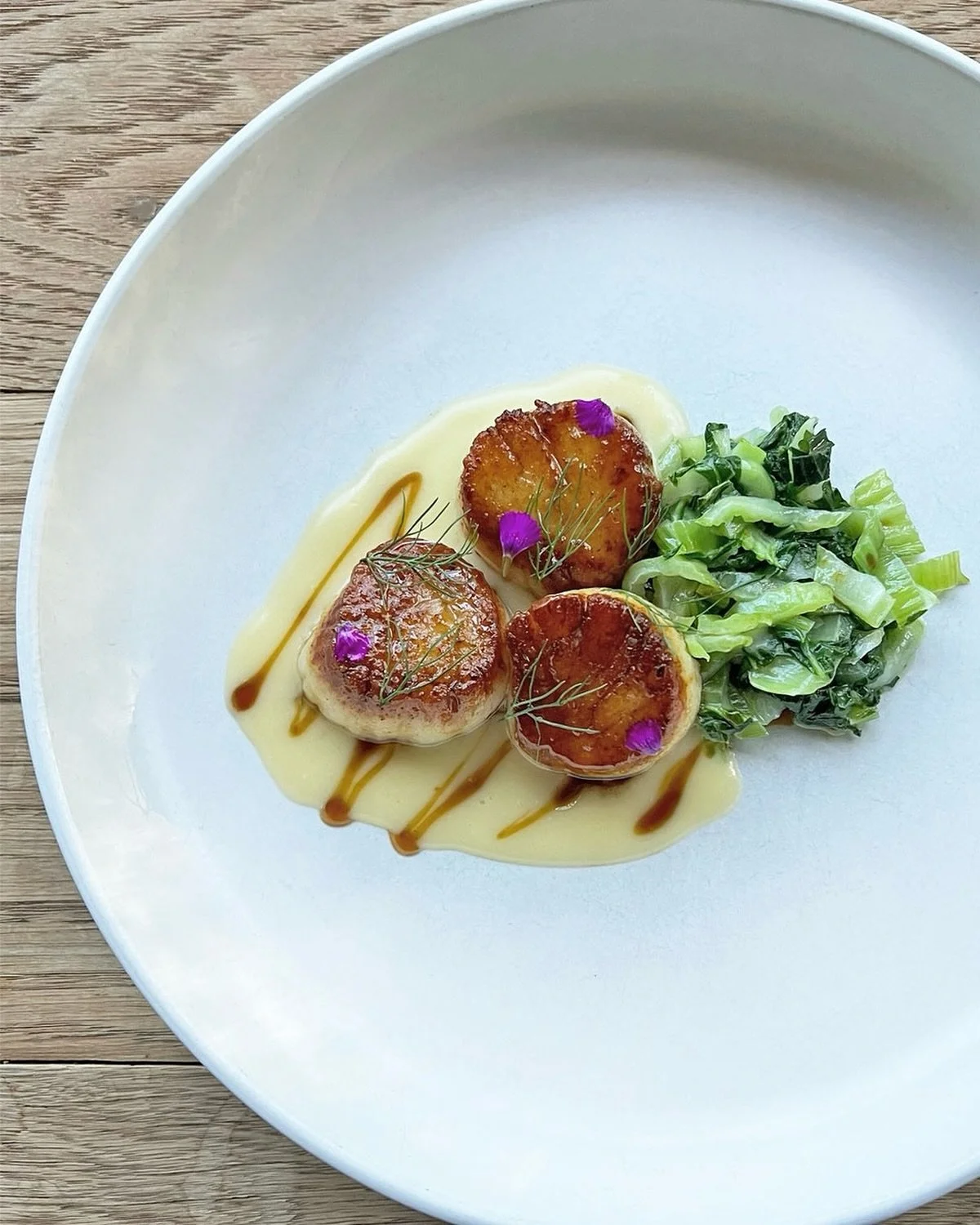 Diver Scallops at Bacchanalia - Served with bok choi, verjue and beurre blanc